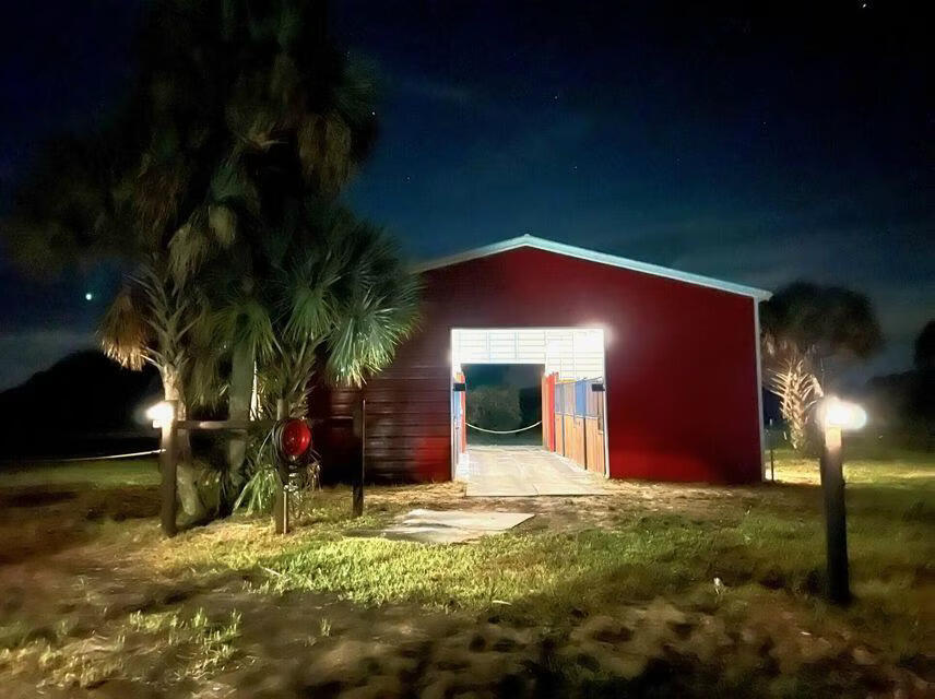 1303 Cabbage Lane Okeechobee, FL 34974 - Photo 7 of 14 a view of a house with a yard