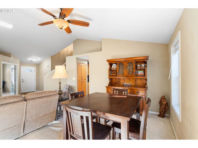 a kitchen with a stove a sink and a refrigerator