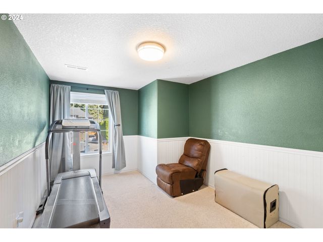 a bathroom with a granite countertop sink toilet and a mirror