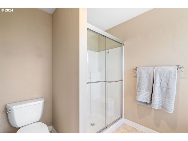 a bathroom with a bathtub sink and a mirror