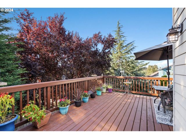 a terrace with outdoor seating and wooden floor