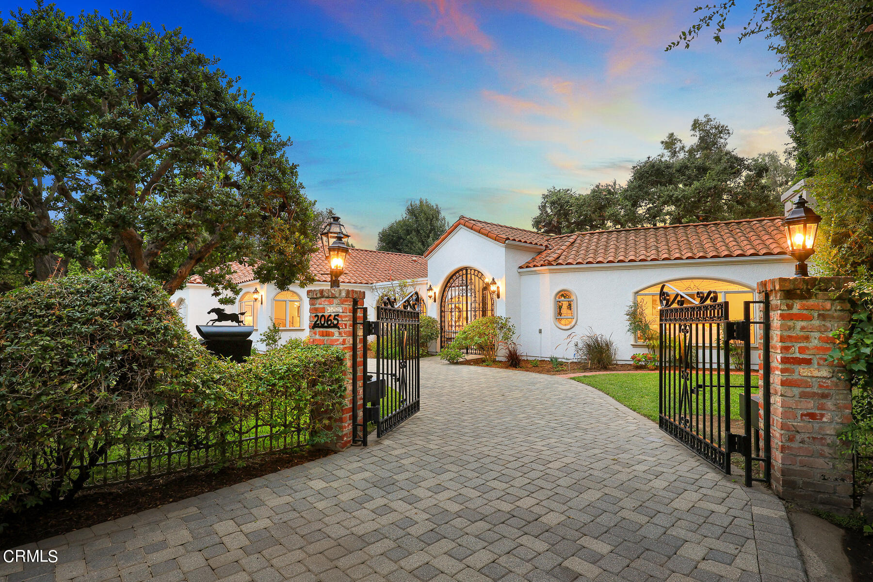2065 Ashbourne Drive South Pasadena, CA 91030 - Photo 2 of 17 a view of a white house with a big yard and potted plants