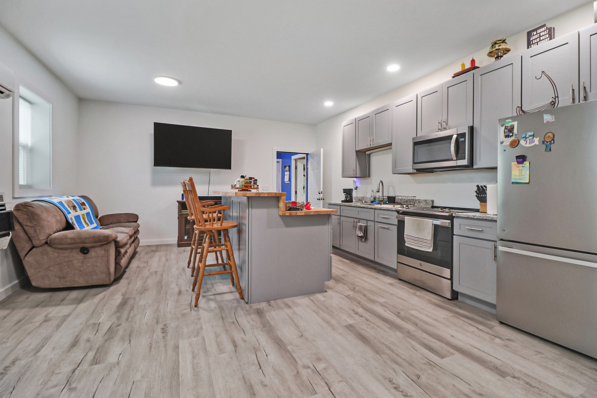 148 Porter Lane Spring City, TN 37381 - Photo 14 of 53 a living room with stainless steel appliances furniture and a flat screen tv