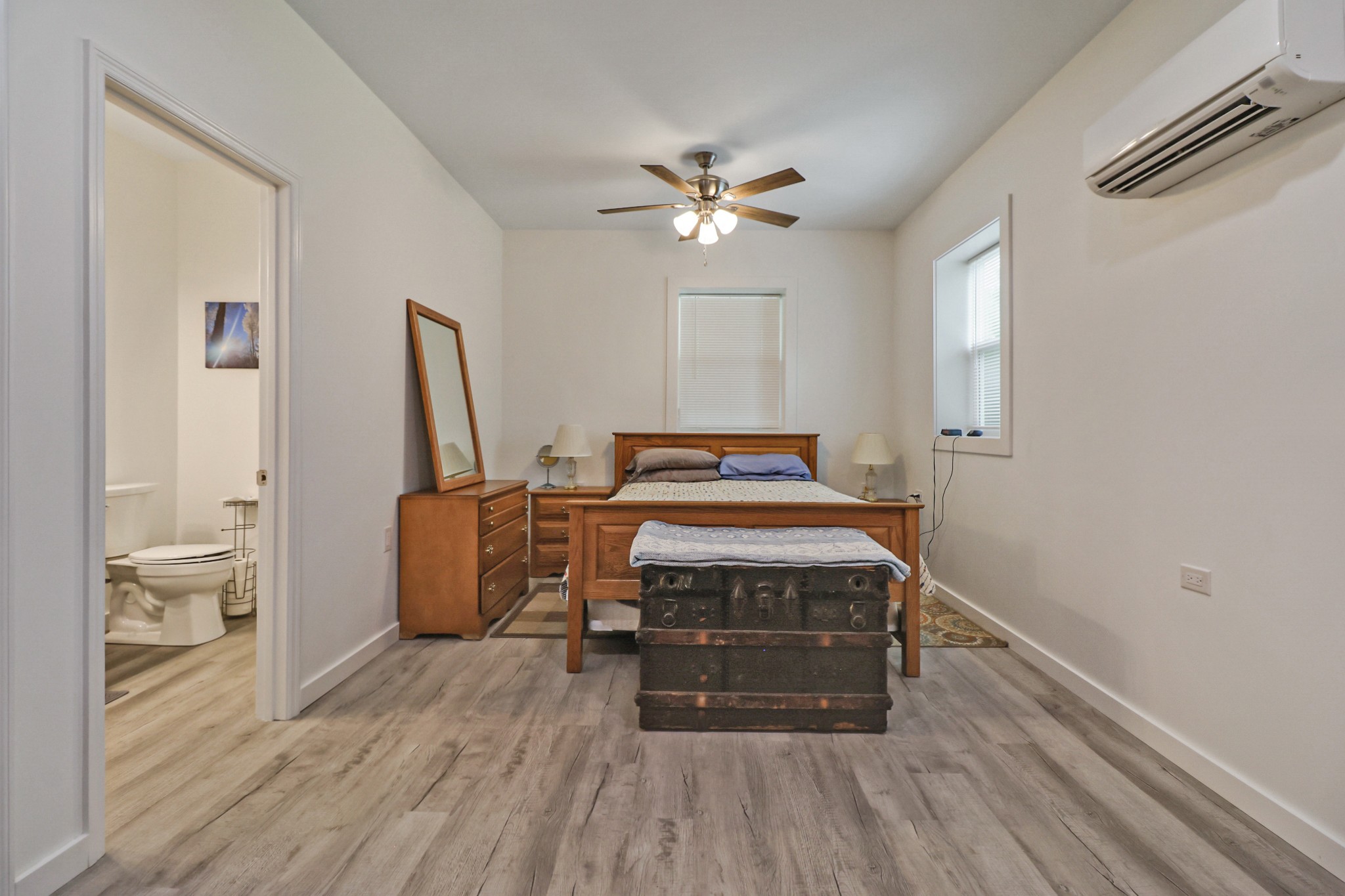 148 Porter Lane Spring City, TN 37381 - Photo 15 of 53 a bedroom with a bed and wooden floor