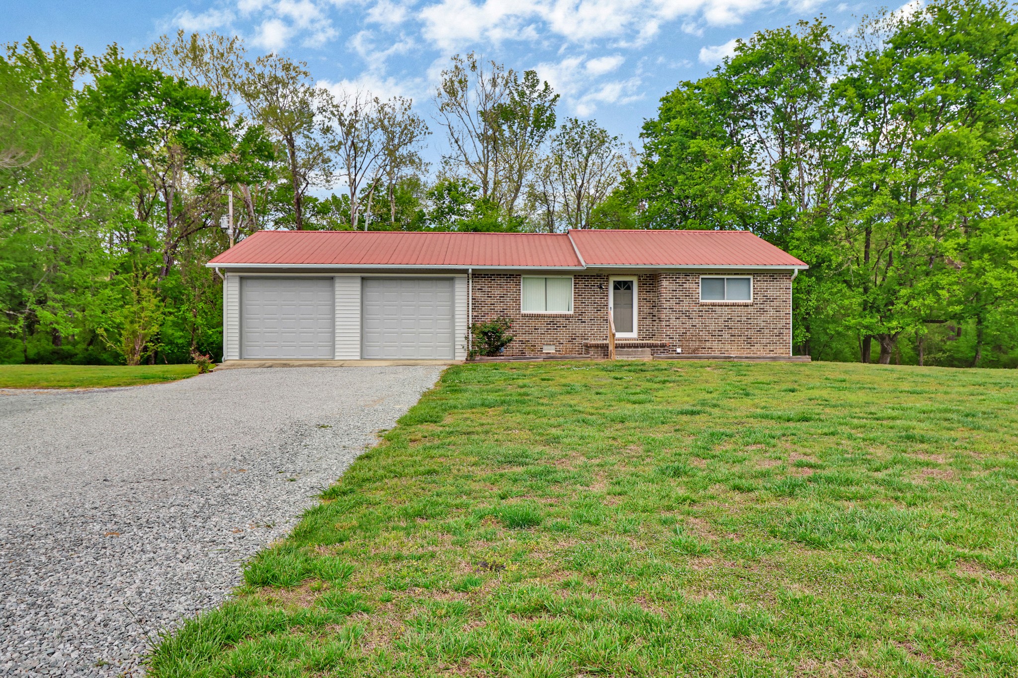 148 Porter Lane Spring City, TN 37381 - Photo 20 of 53 a front view of a house with a yard