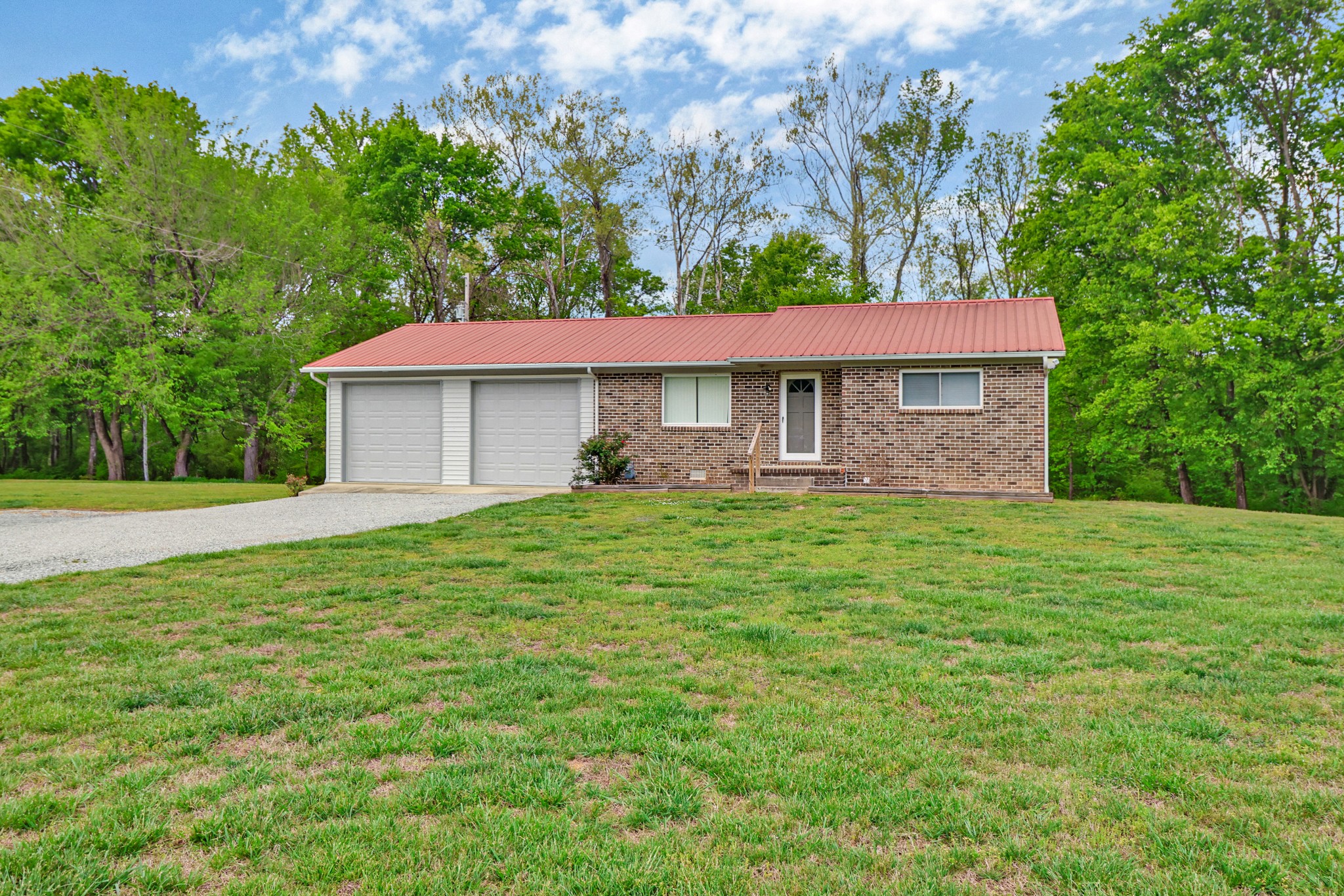 148 Porter Lane Spring City, TN 37381 - Photo 21 of 53 a front view of a house with a yard