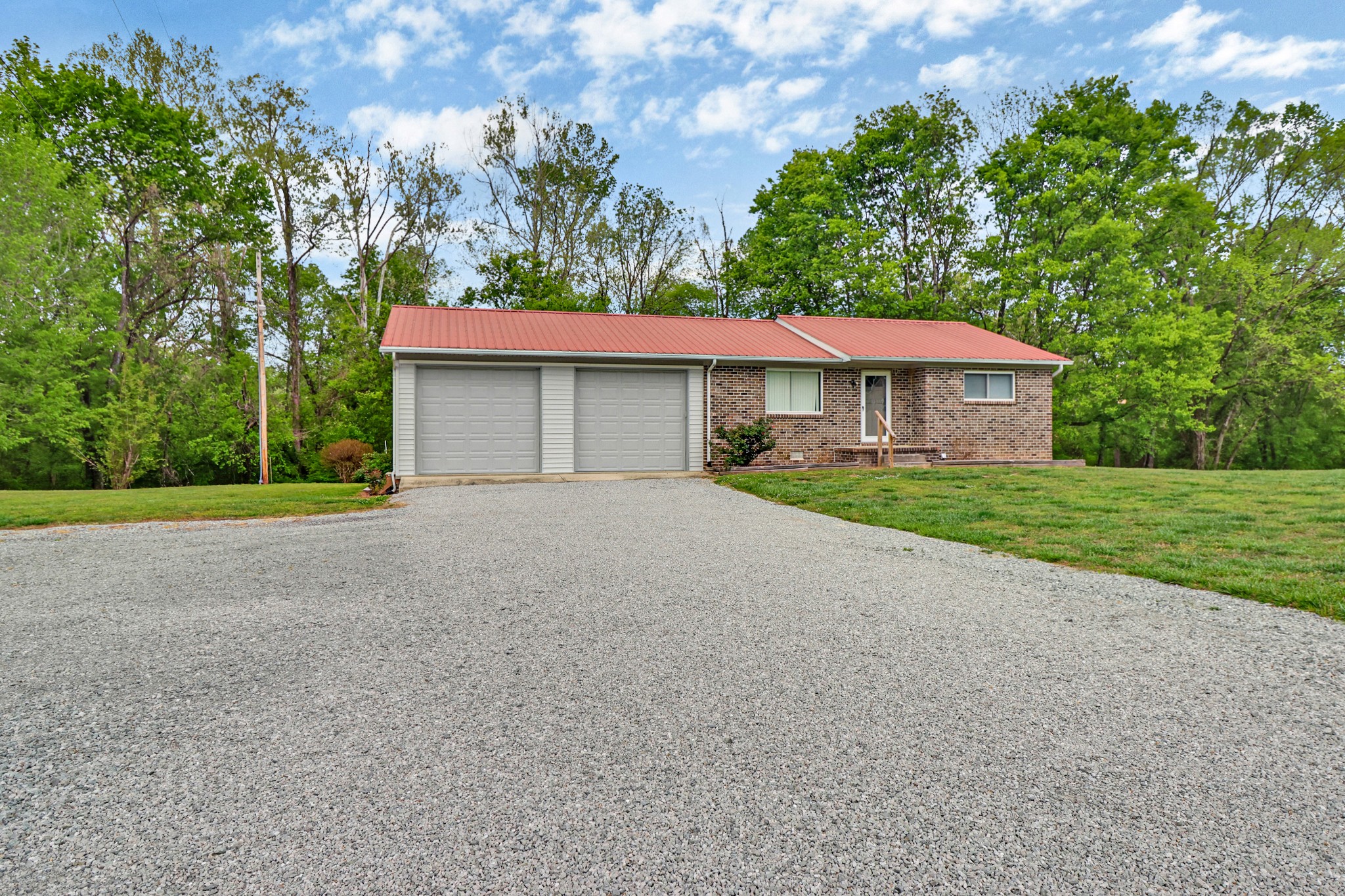 148 Porter Lane Spring City, TN 37381 - Photo 22 of 53 a house with yard in front of it
