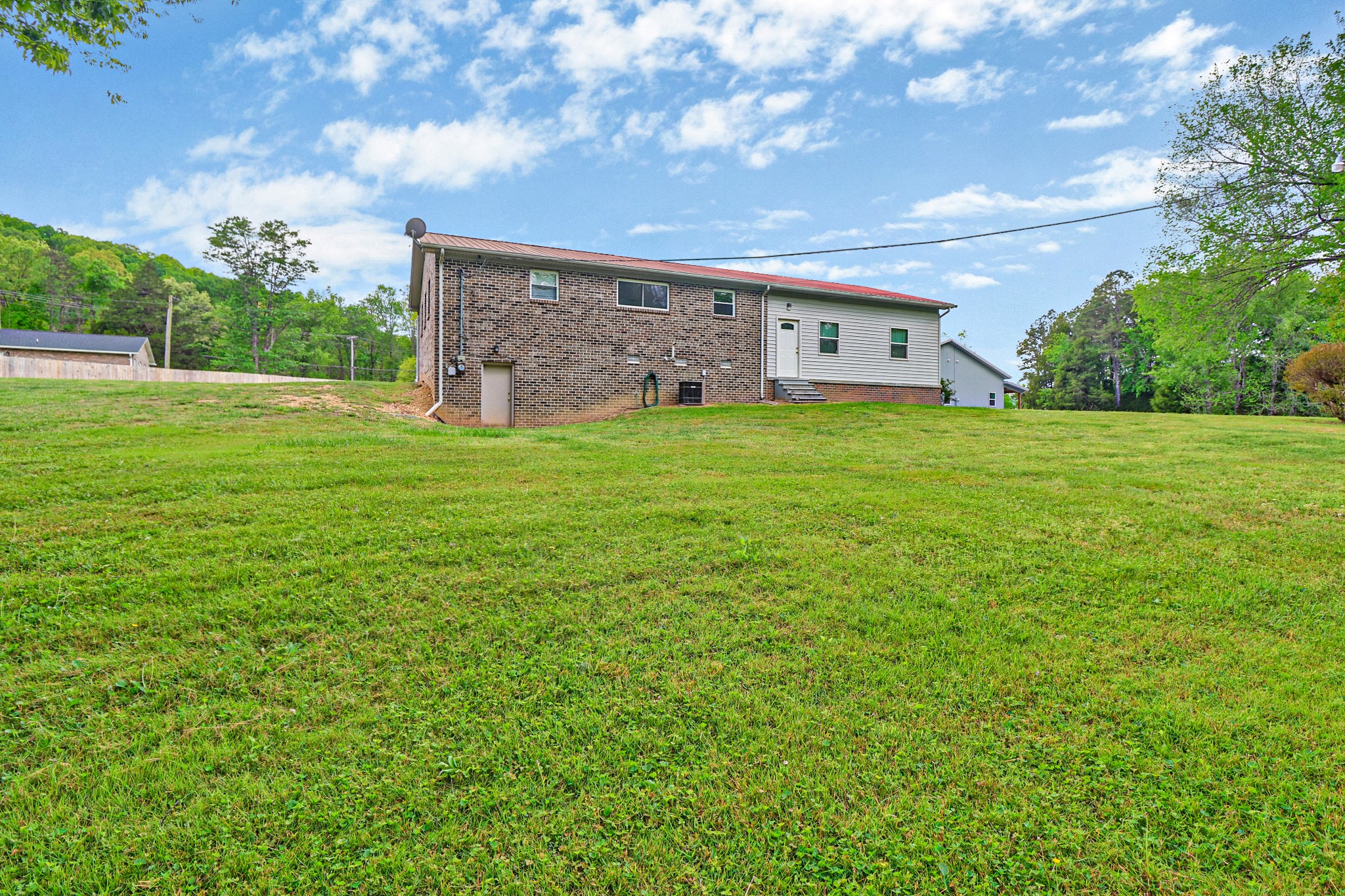 148 Porter Lane Spring City, TN 37381 - Photo 24 of 53 a front view of a house with garden