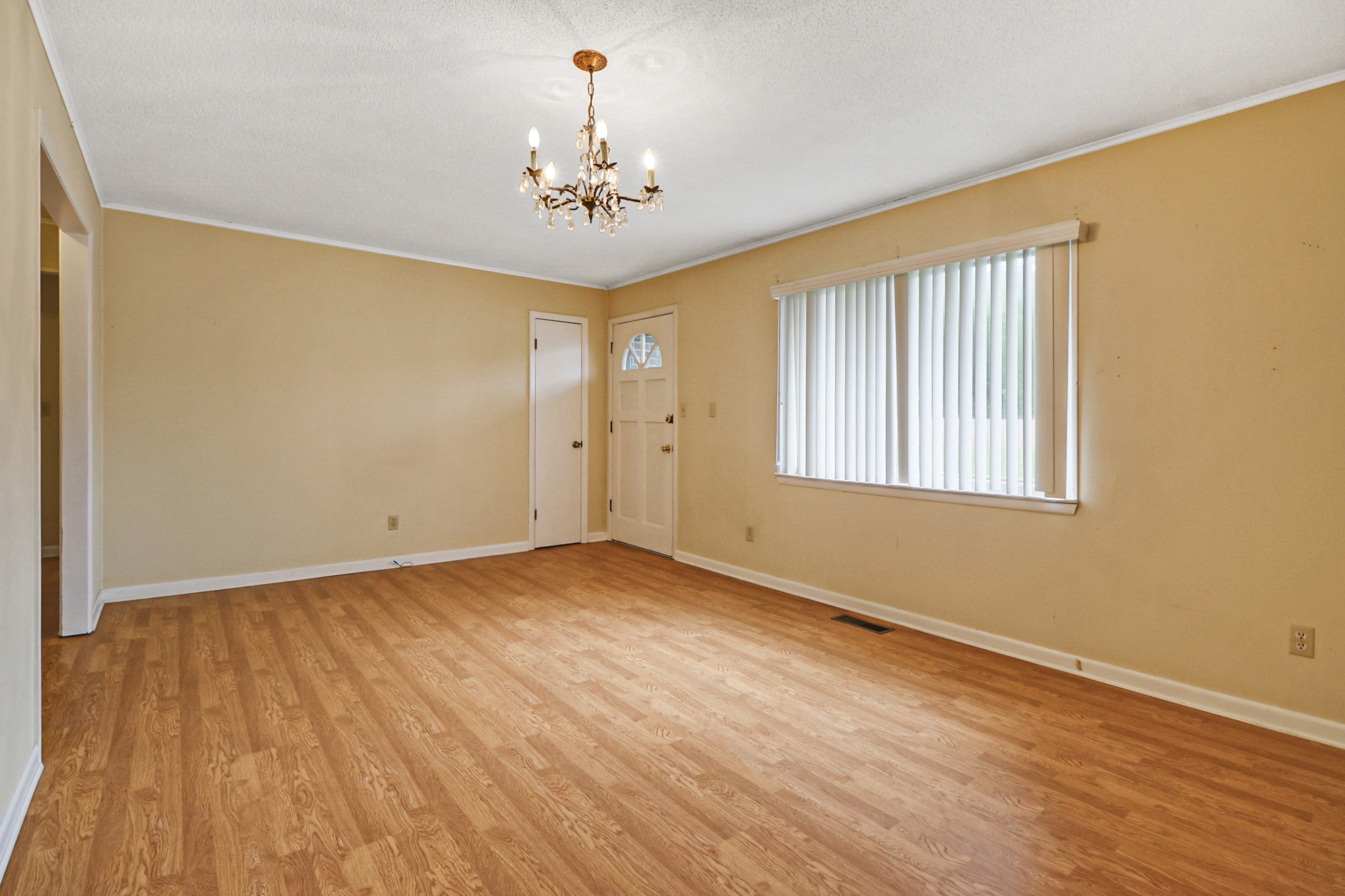 148 Porter Lane Spring City, TN 37381 - Photo 27 of 53 a view of an empty room with a window and wooden floor