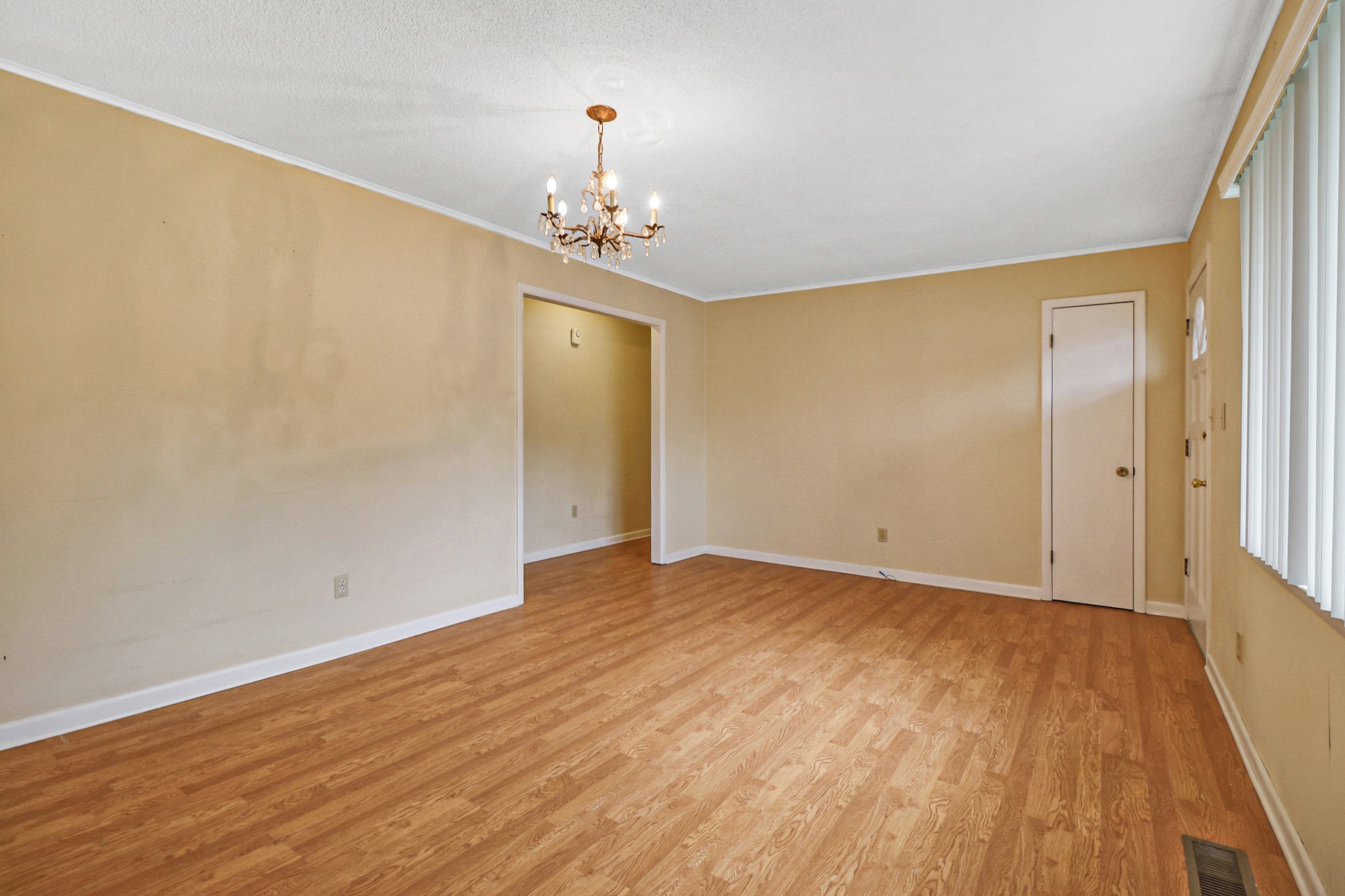 148 Porter Lane Spring City, TN 37381 - Photo 28 of 53 a view of an empty room with wooden floor and chandelier