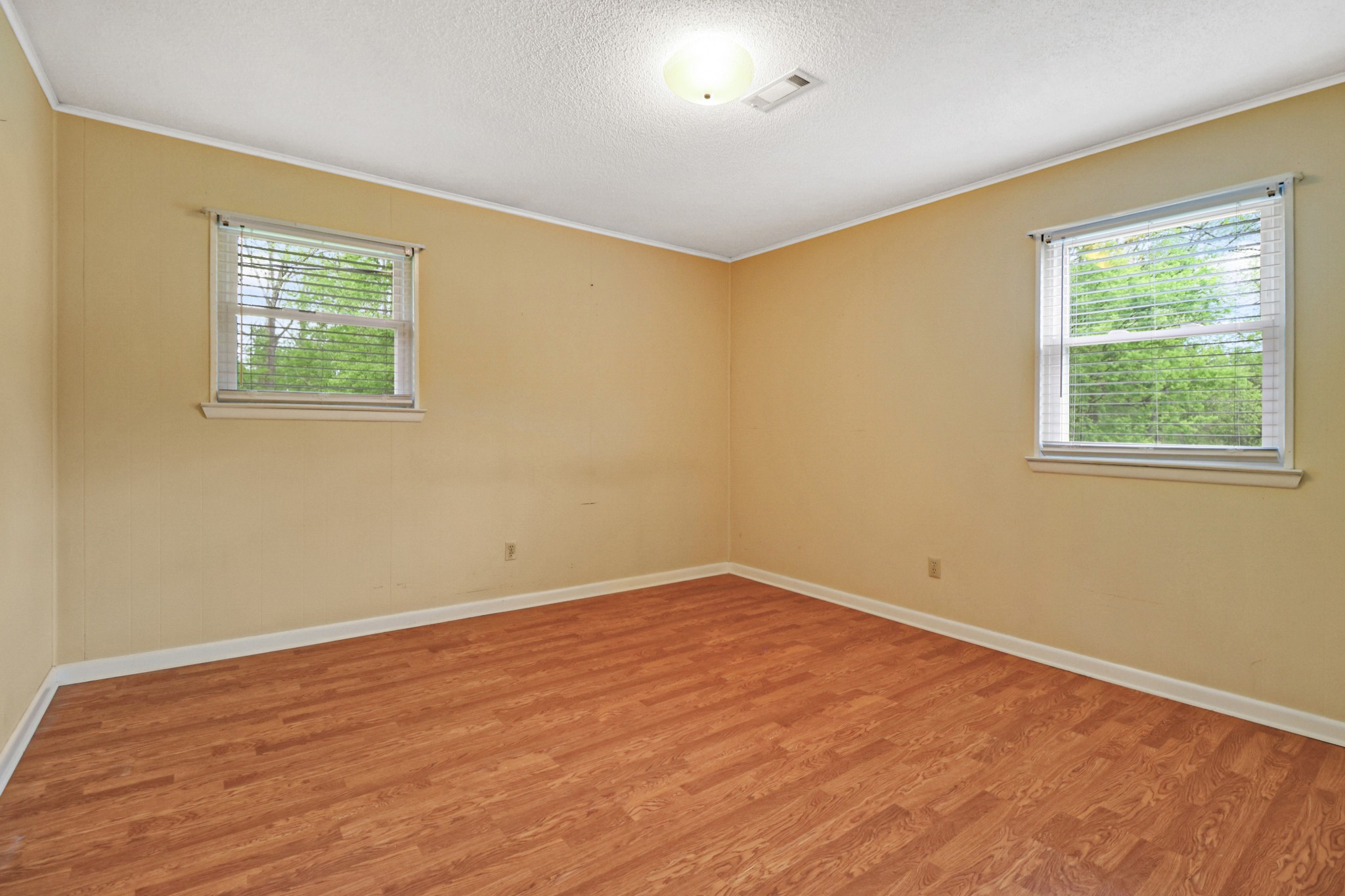 148 Porter Lane Spring City, TN 37381 - Photo 36 of 53 a view of an empty room with wooden floor and a window