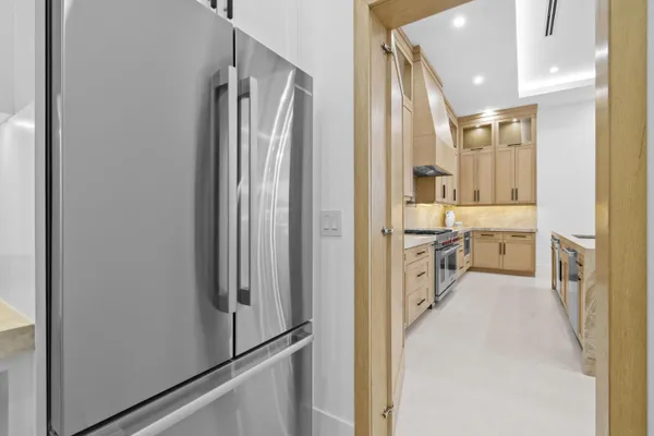 a bathroom with a granite countertop sink a toilet and shower