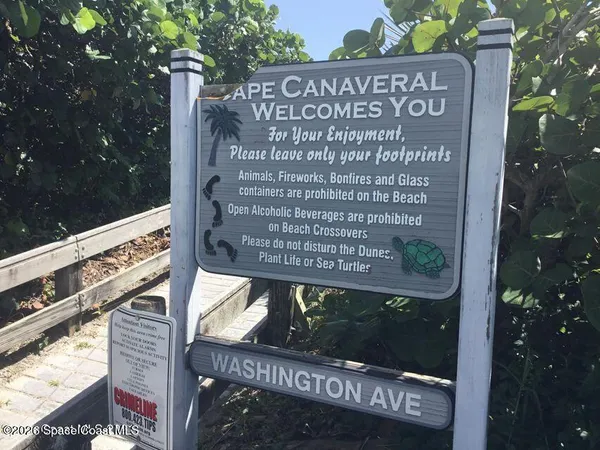 a view of a field with an ocean