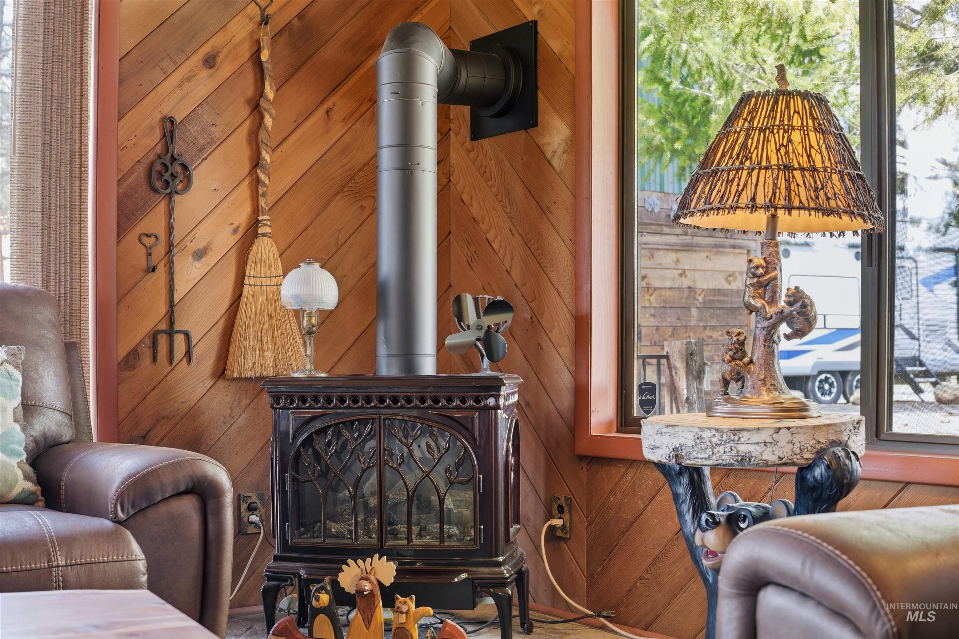 45 Rainbow Ridge Road Garden Valley, ID 83622 - Photo 12 of 41 Detailed view of a wood stove and wooden walls
