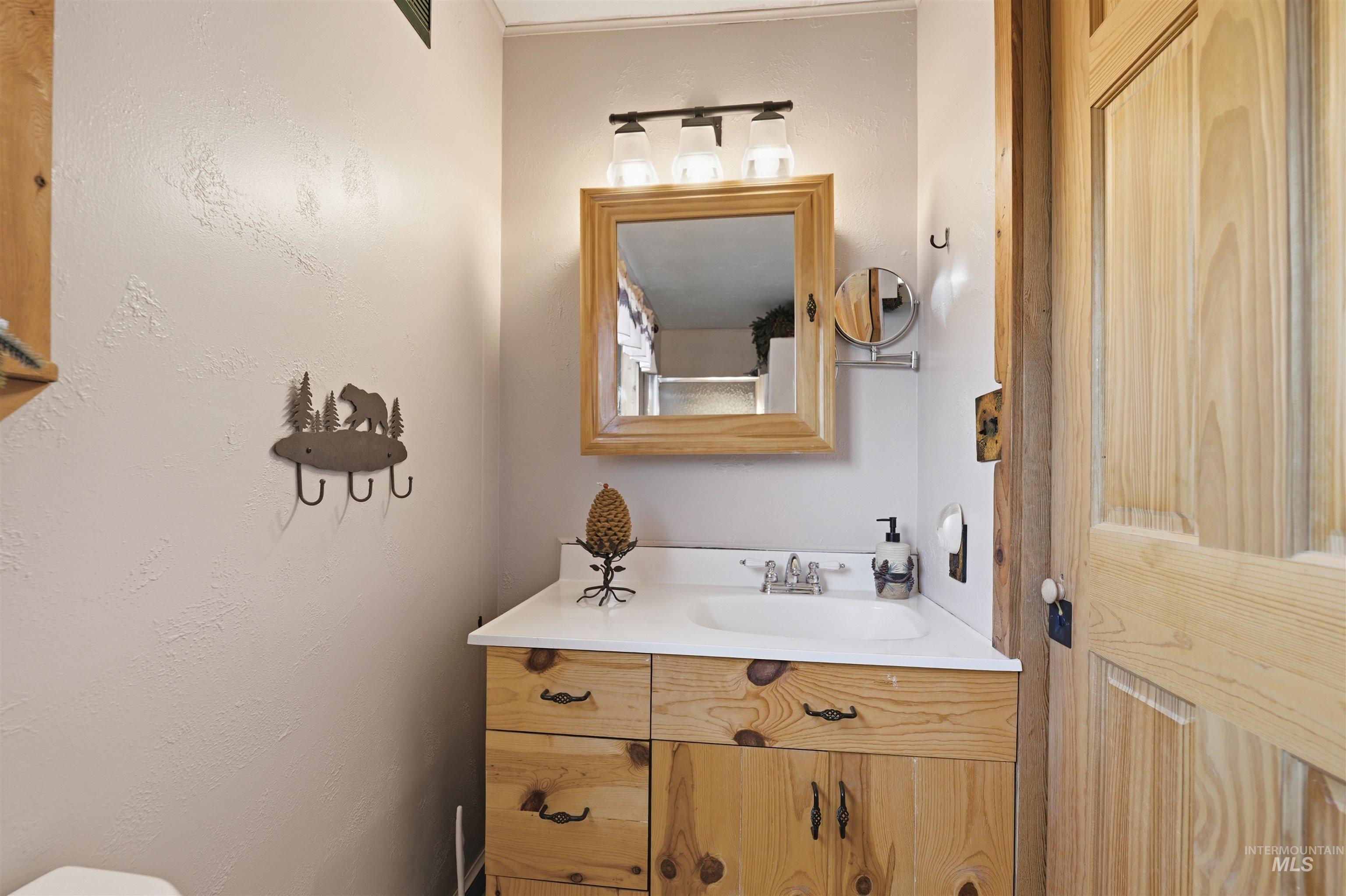 45 Rainbow Ridge Road Garden Valley, ID 83622 - Photo 21 of 41 Half bath featuring vanity