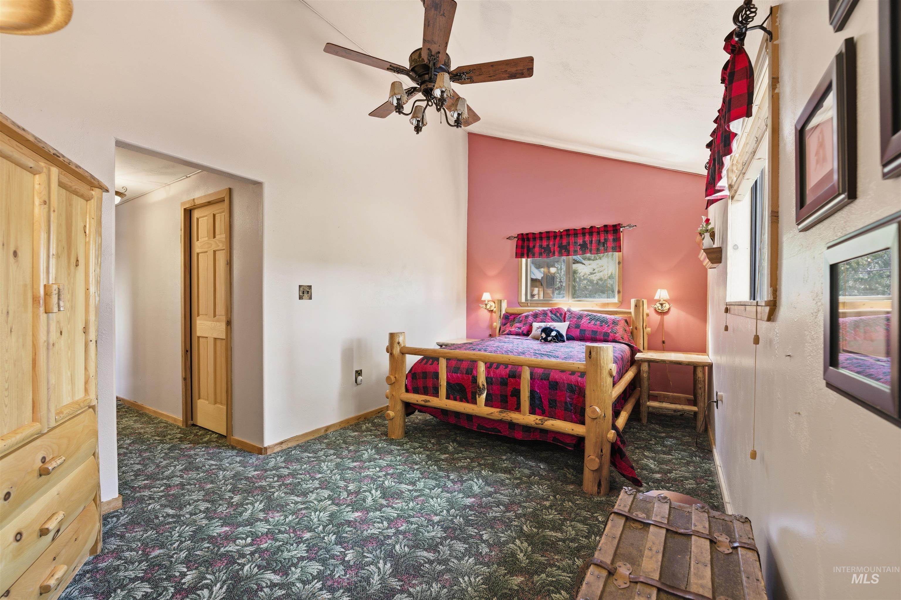 45 Rainbow Ridge Road Garden Valley, ID 83622 - Photo 25 of 41 Bedroom featuring lofted ceiling, dark colored carpet, and a ceiling fan