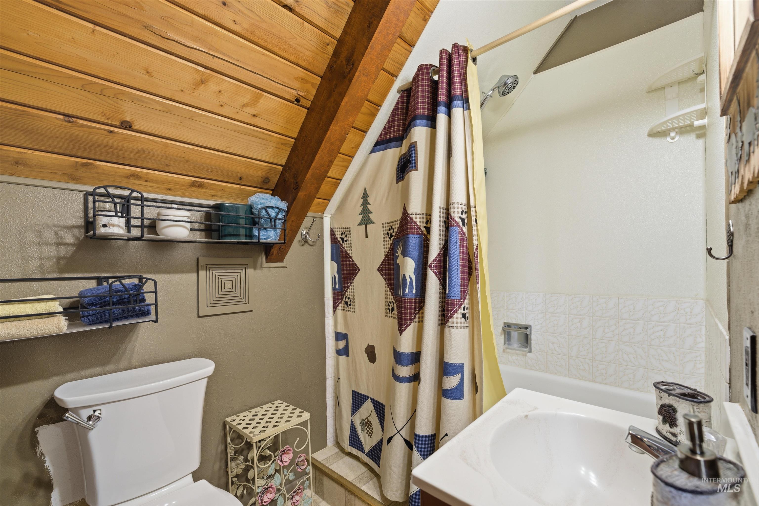 45 Rainbow Ridge Road Garden Valley, ID 83622 - Photo 32 of 41 Bathroom featuring a stall shower, a vaulted wood ceiling, and vanity