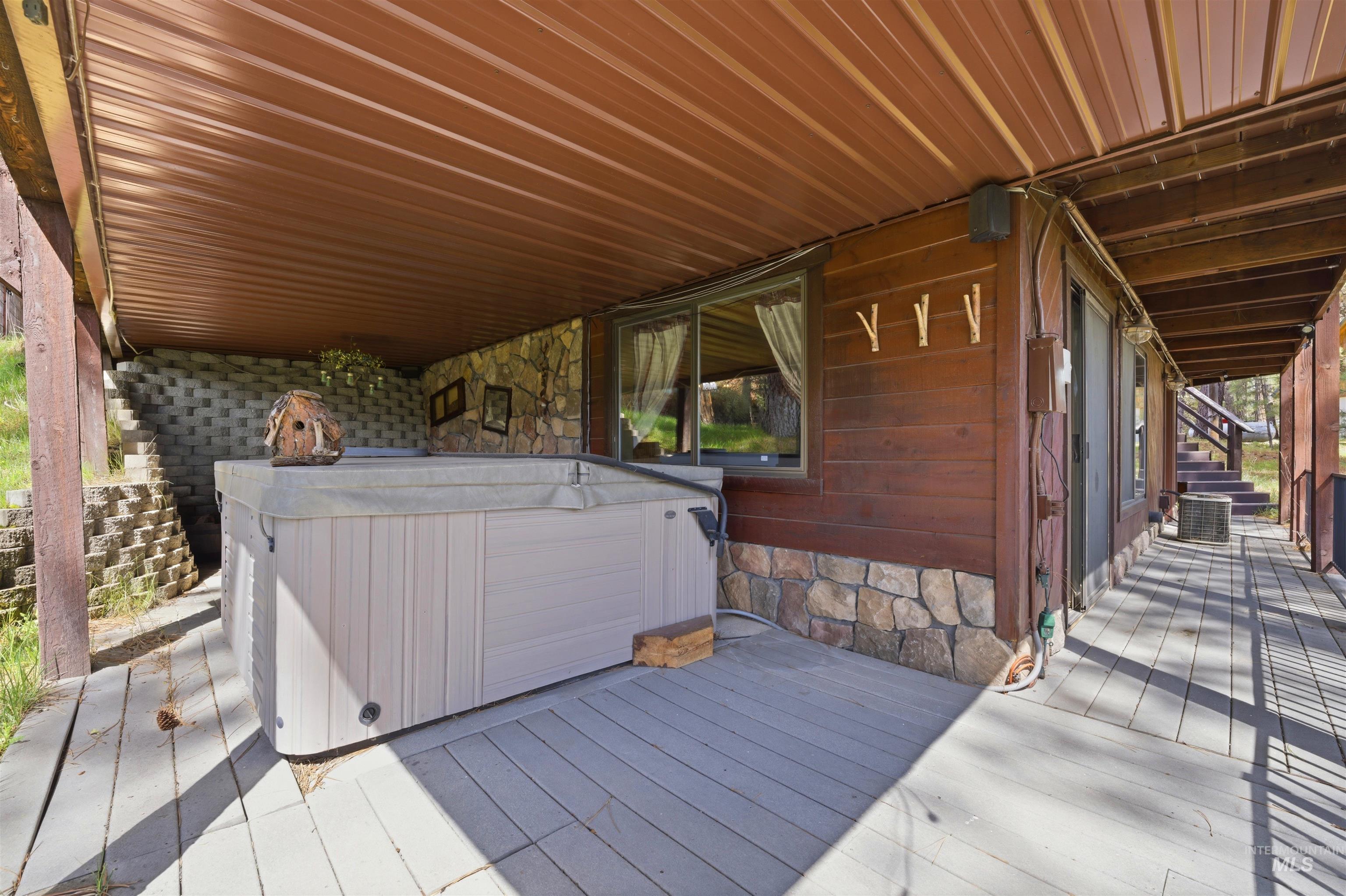 45 Rainbow Ridge Road Garden Valley, ID 83622 - Photo 38 of 41 Wooden deck with a hot tub