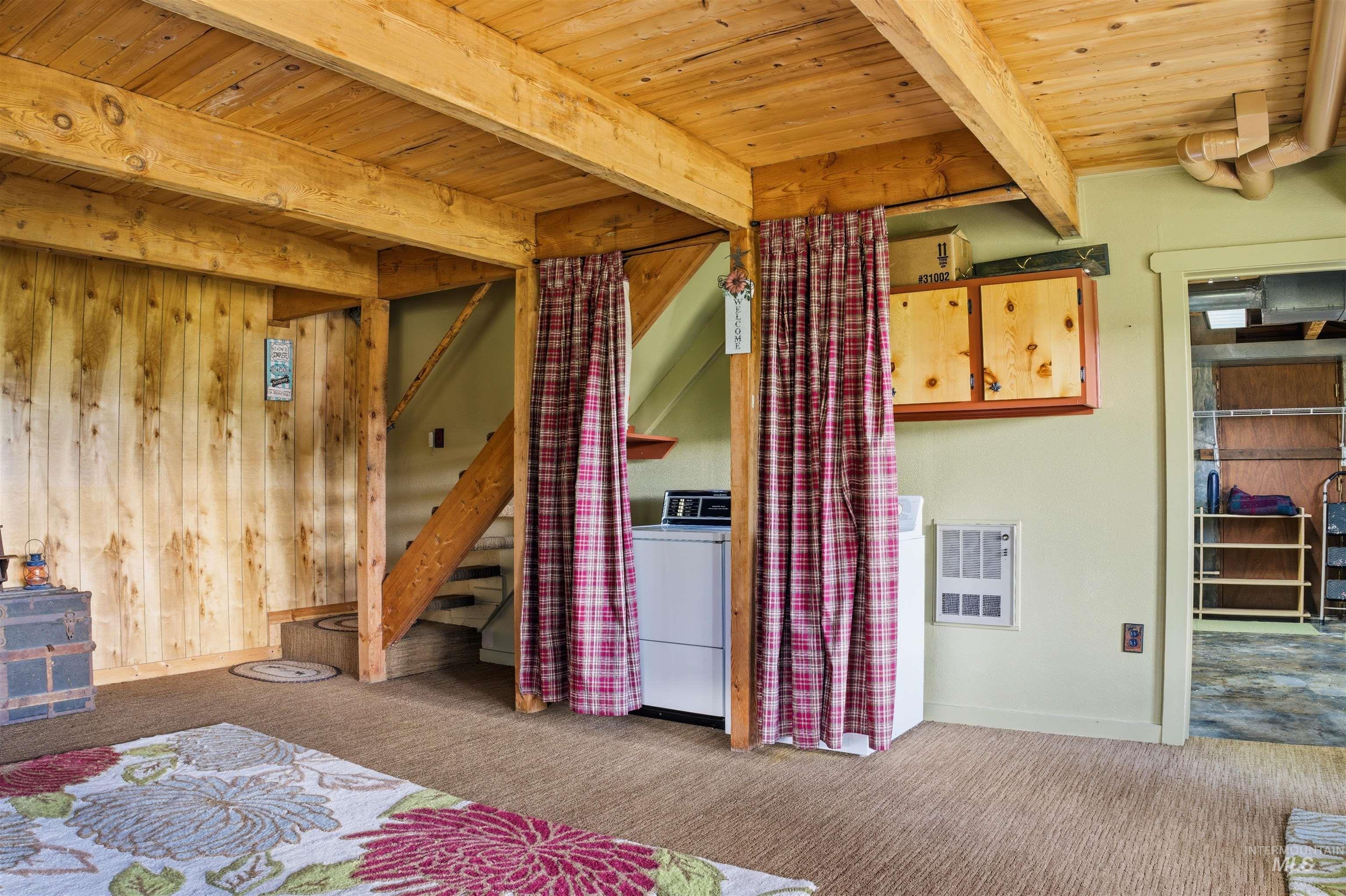 45 Rainbow Ridge Road Garden Valley, ID 83622 - Photo 39 of 41 Bedroom with a wooden ceiling with exposed beams, carpet flooring, washer / clothes dryer, and heating unit