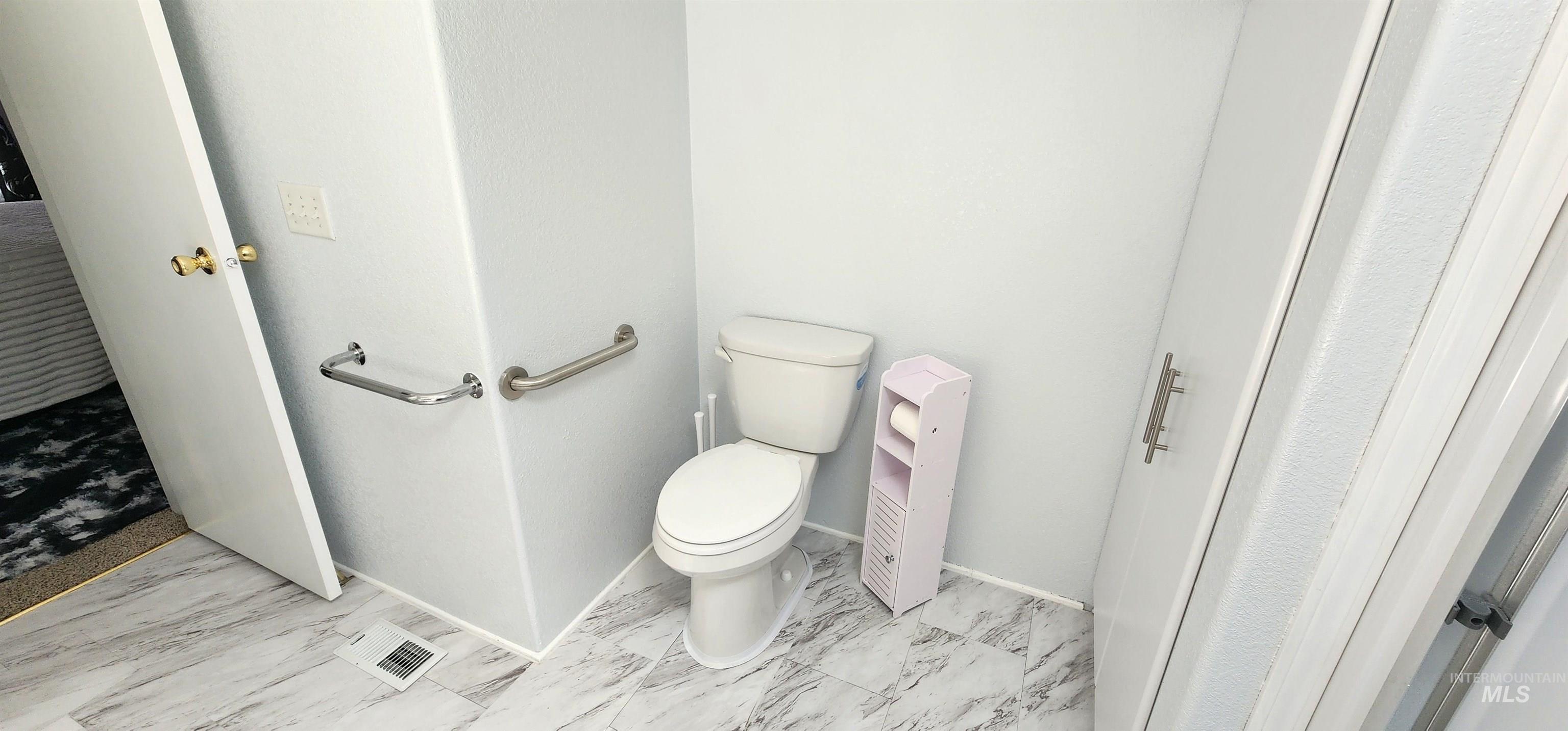 2115 6th Avenue, Unit 51 Clarkston, WA 99403 - Photo 17 of 45 Bathroom with toilet and marble look tiles