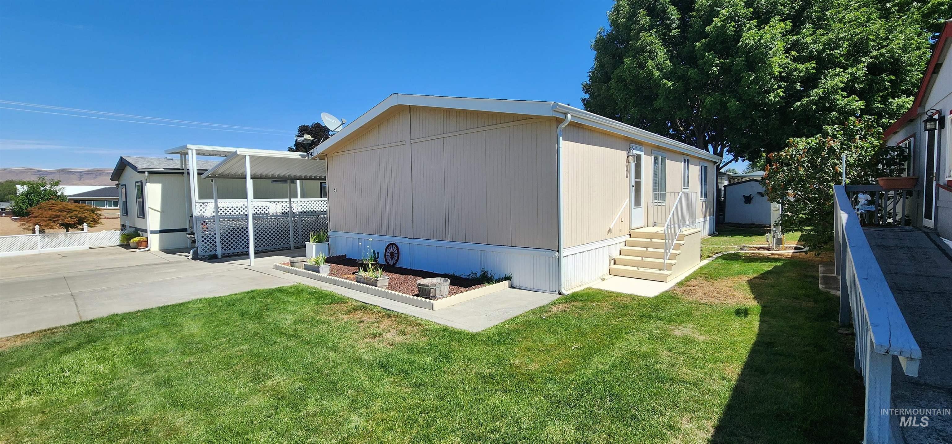 2115 6th Avenue, Unit 51 Clarkston, WA 99403 - Photo 41 of 45 View of property exterior with a lawn