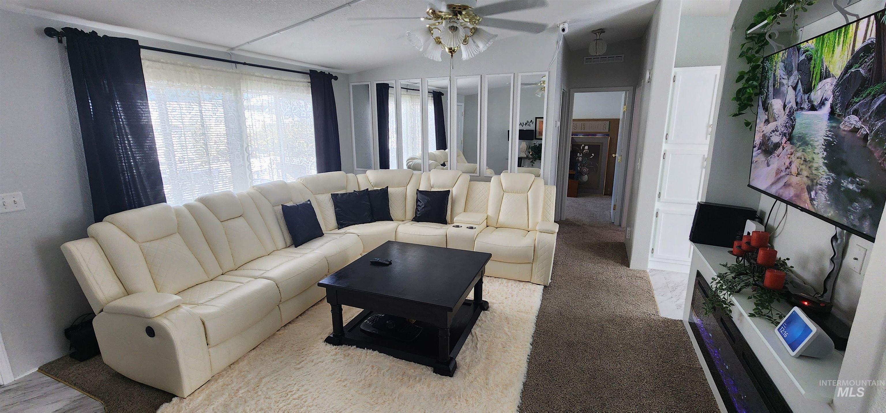 2115 6th Avenue, Unit 51 Clarkston, WA 99403 - Photo 5 of 45 Living room with light carpet and a ceiling fan
