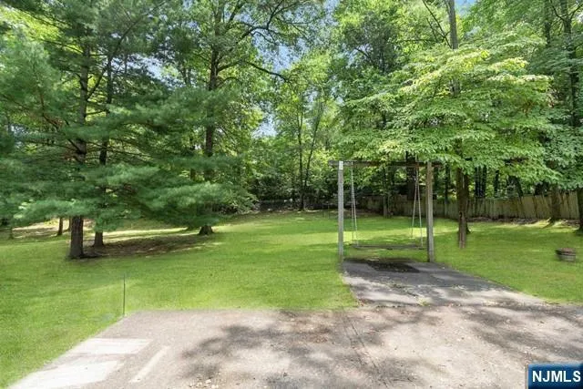 a view of a park with large trees