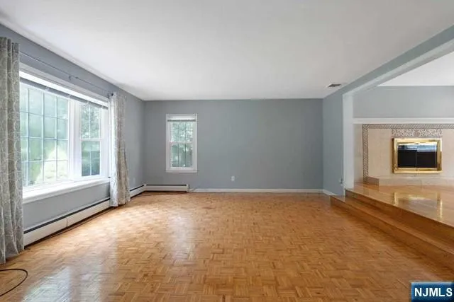 a view of an empty room with a window