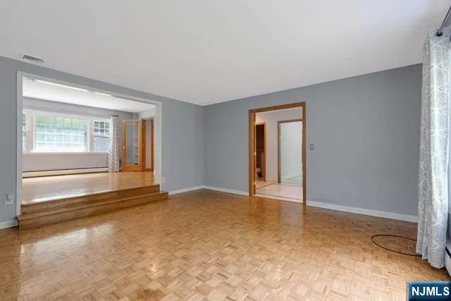 a view of an empty room with a window