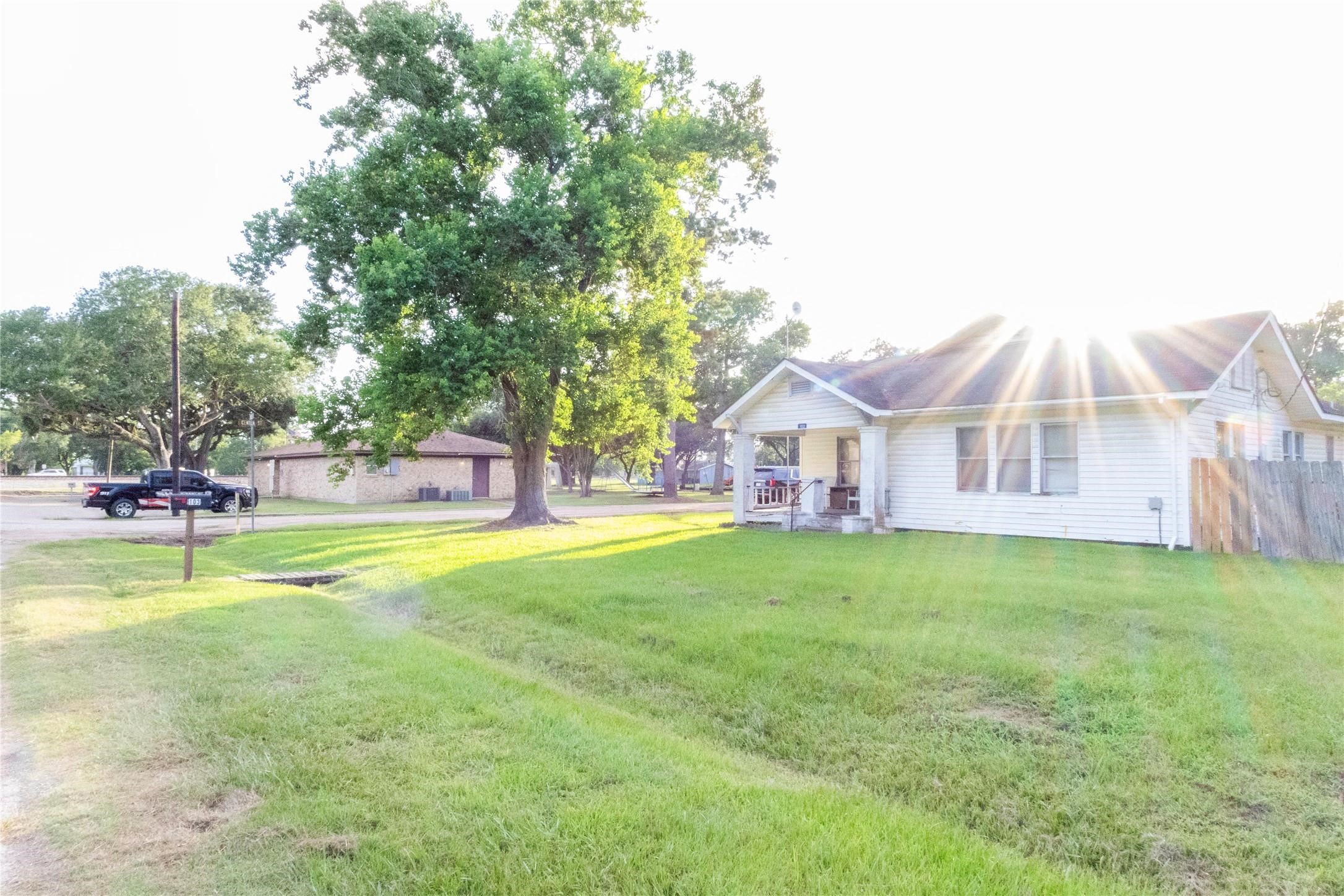 a view of a house with a yard porch and sitting area