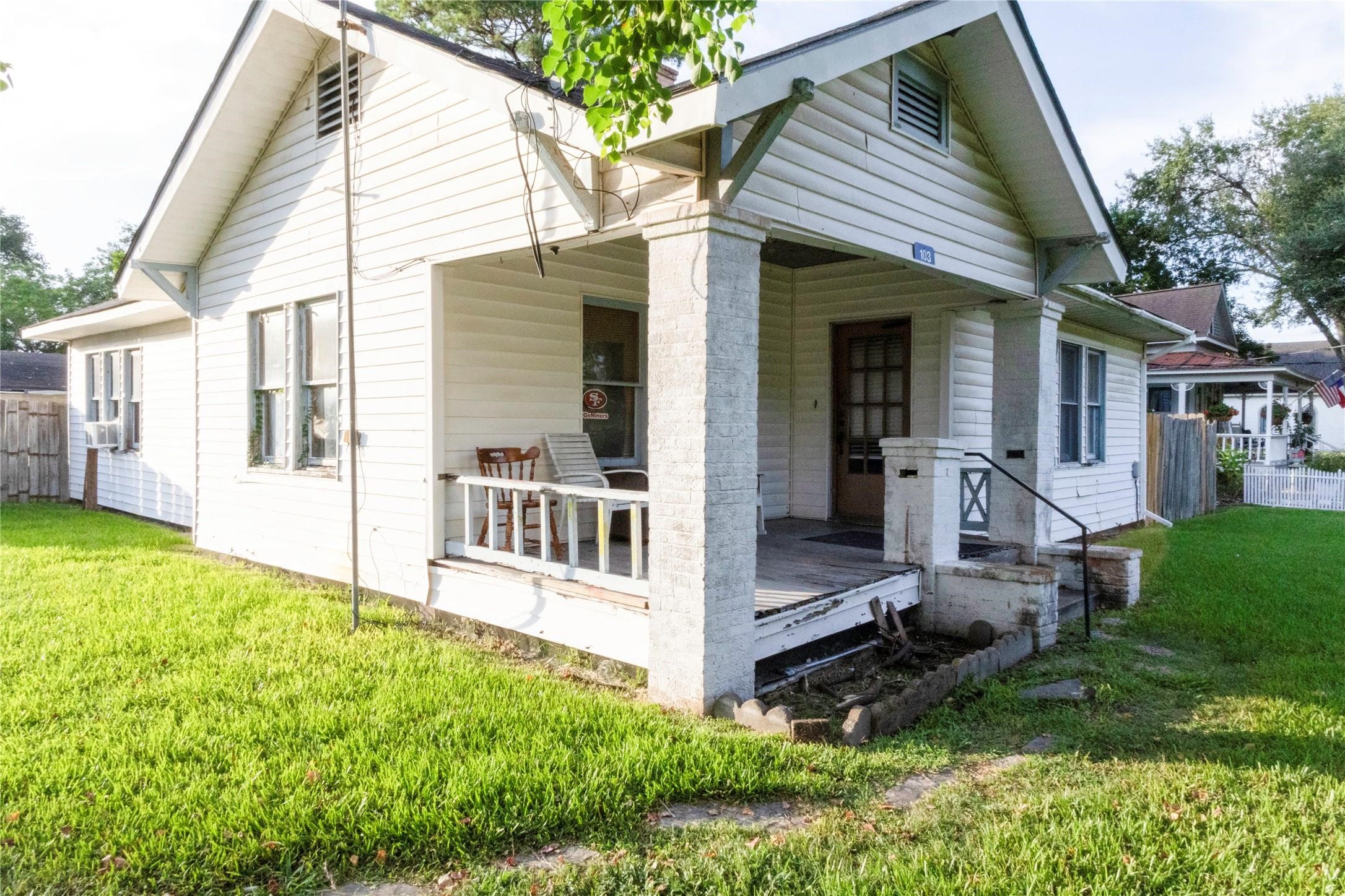 103 Birch Street Wallis, TX 77485 - Photo 2 of 11 a view of house with backyard outdoor seating and hardwood