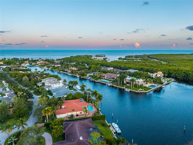 a view of a swimming pool with a yard