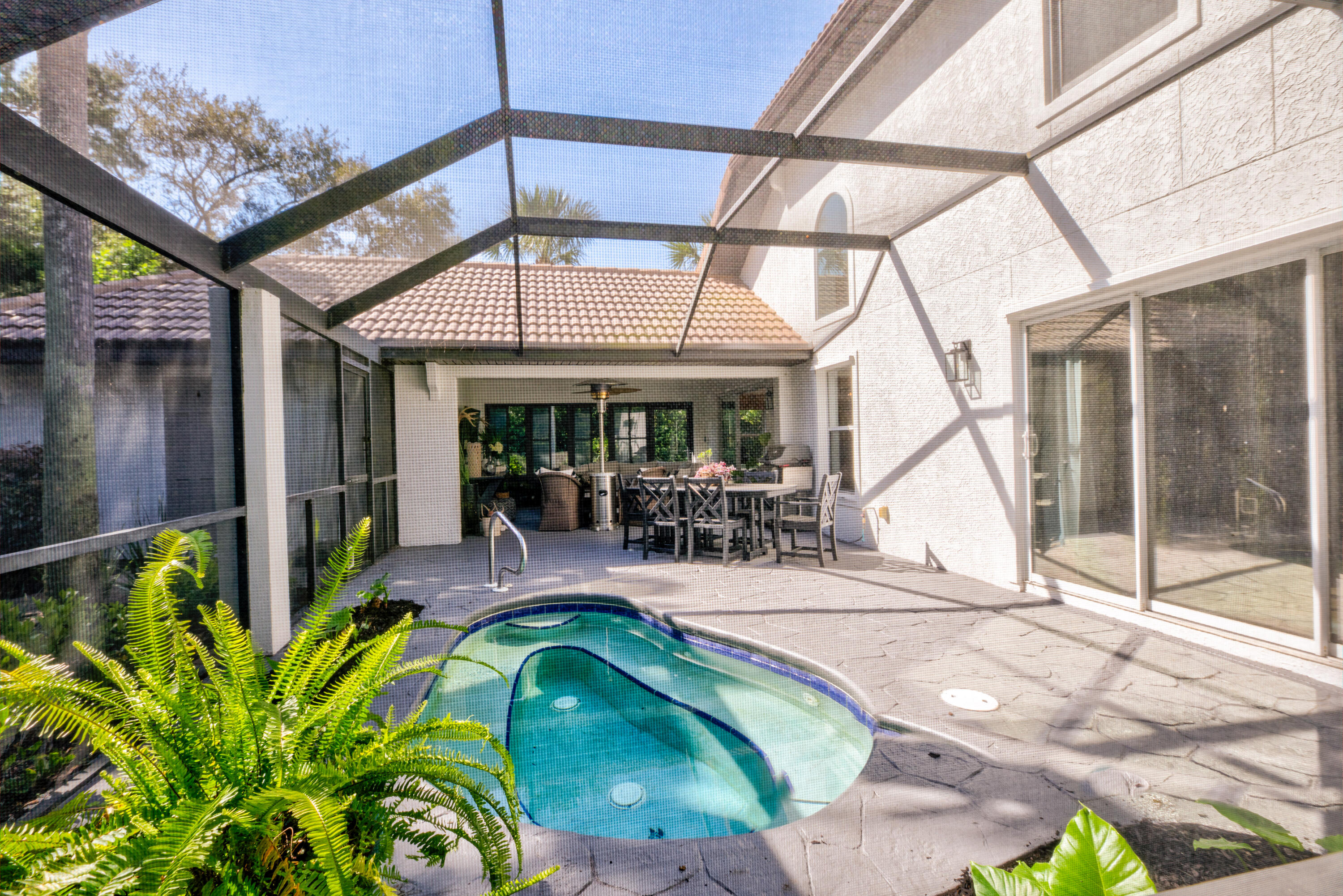 4639 Paradise Isle Destin, FL 32541 - Photo 11 of 67 a view of a swimming pool with a patio