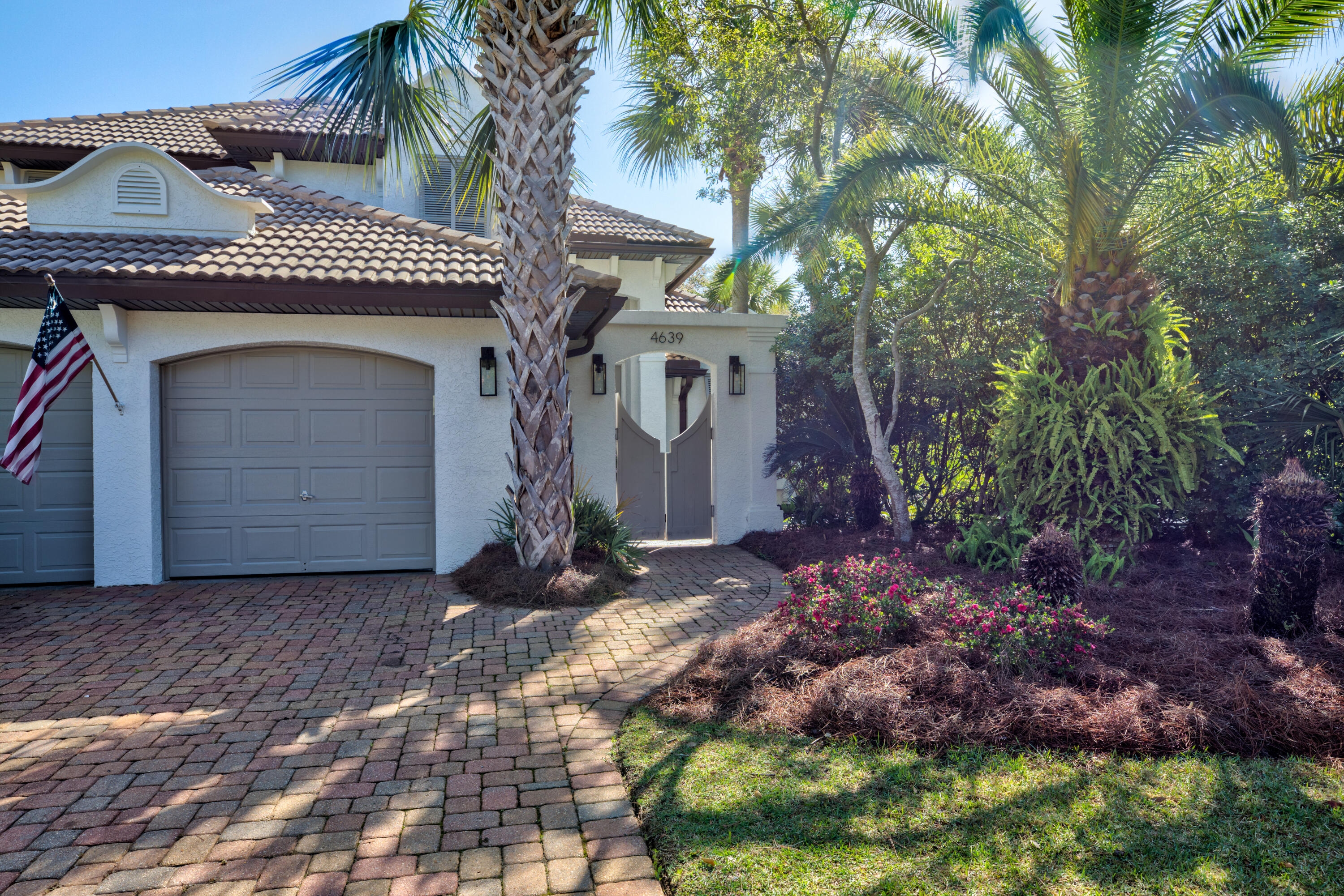 4639 Paradise Isle Destin, FL 32541 - Photo 2 of 67 a front view of a house with a yard
