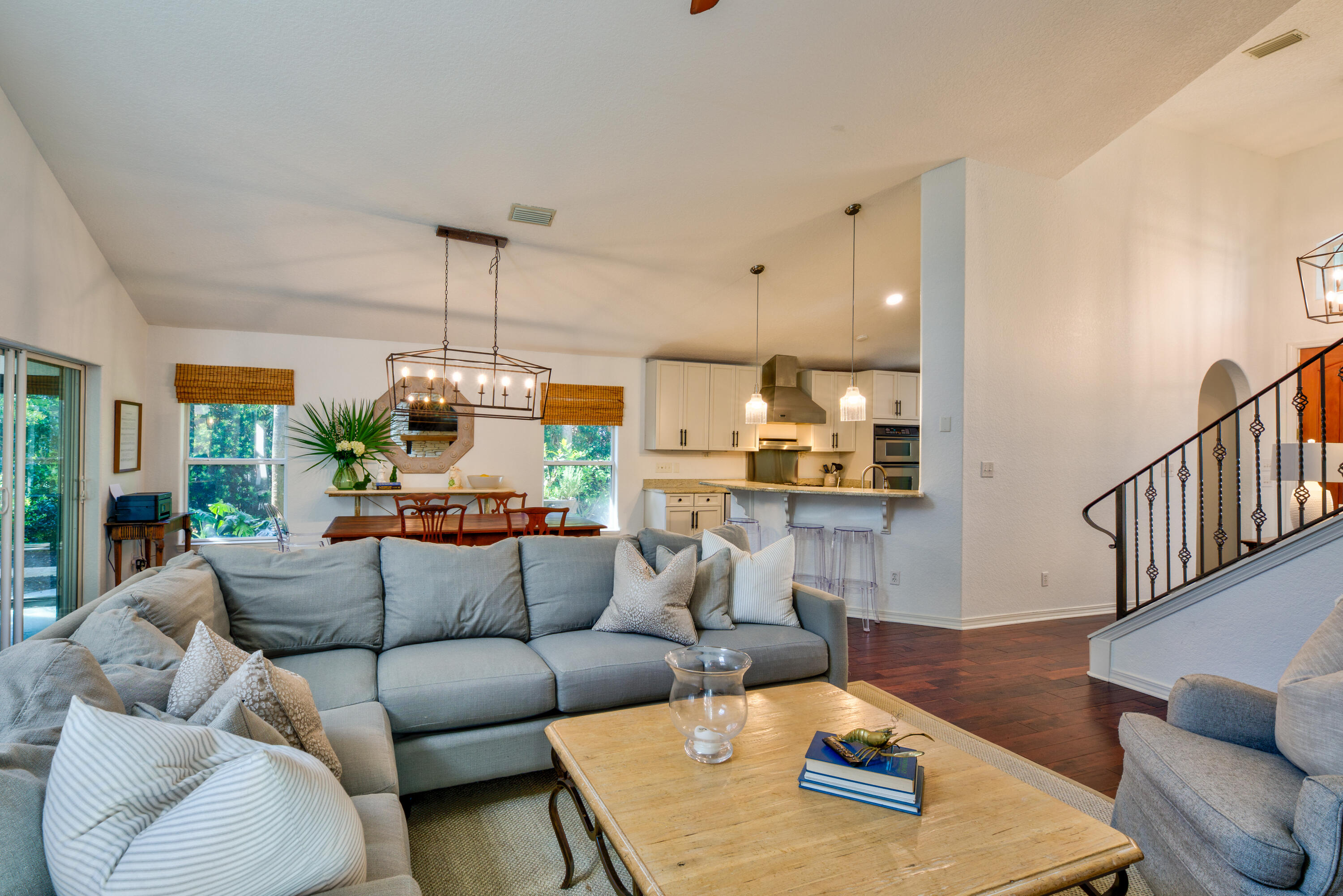 4639 Paradise Isle Destin, FL 32541 - Photo 23 of 67 a living room with furniture and a chandelier