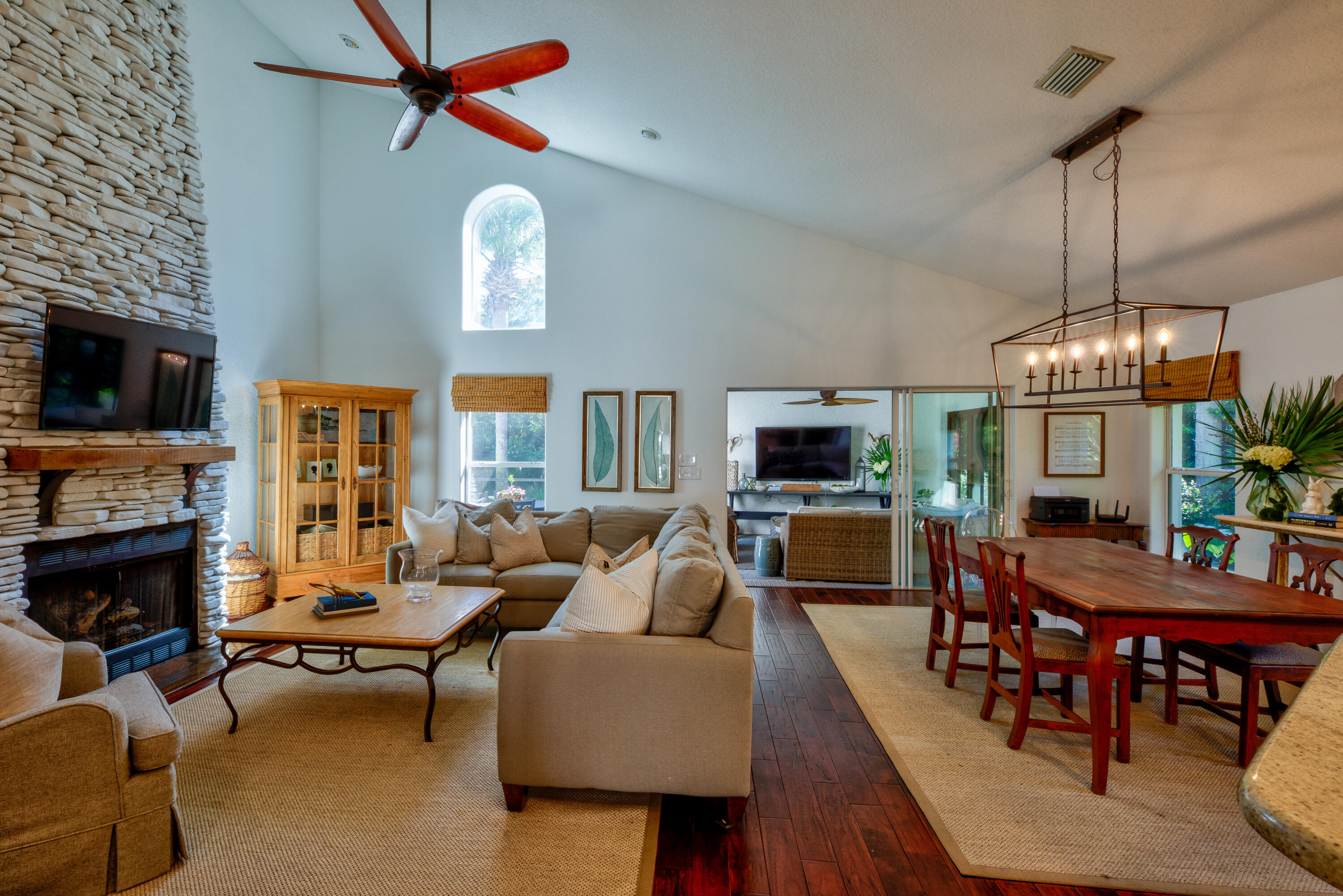 4639 Paradise Isle Destin, FL 32541 - Photo 25 of 67 a living room with fireplace furniture and a flat screen tv
