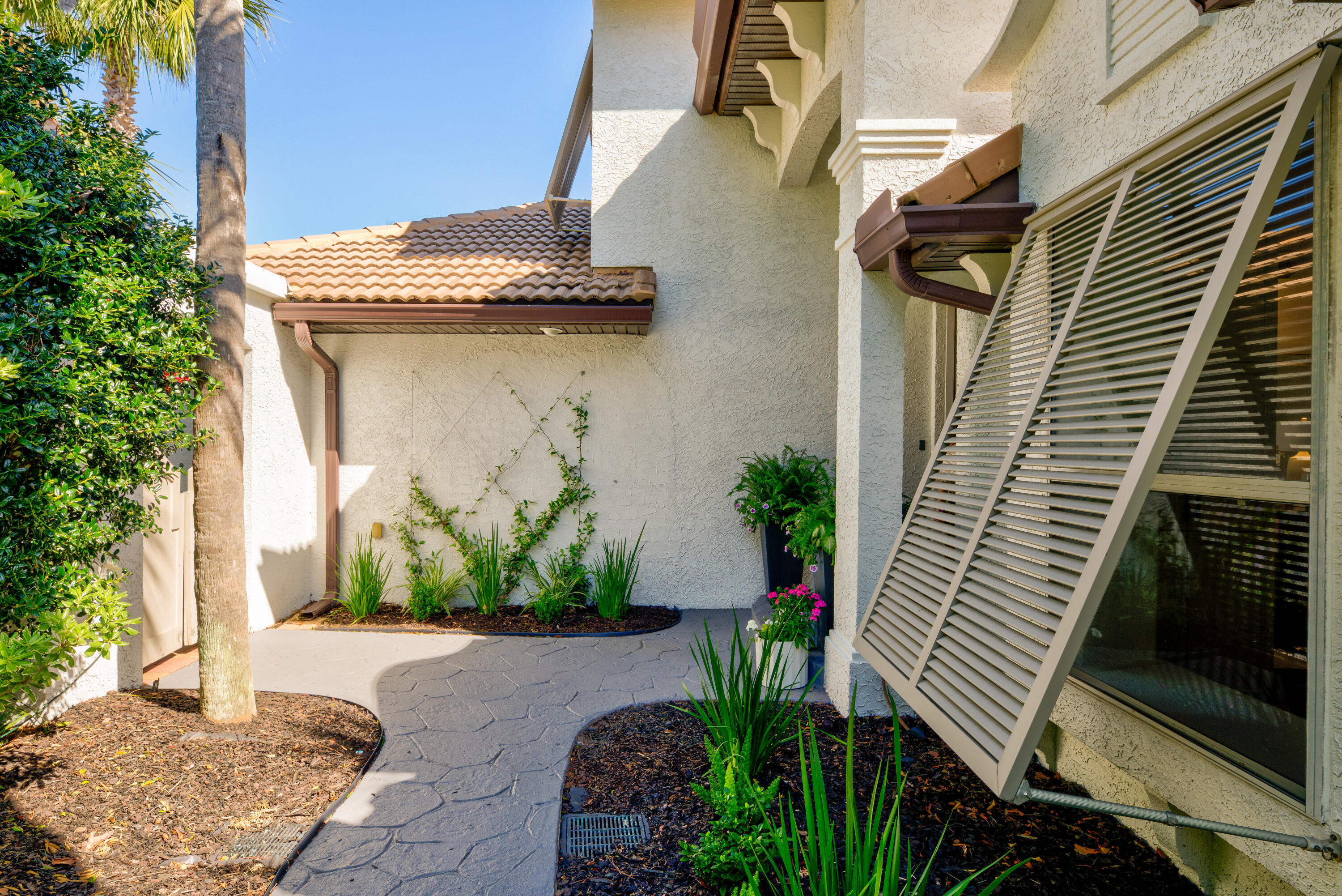 4639 Paradise Isle Destin, FL 32541 - Photo 31 of 67 a front view of a house with garden