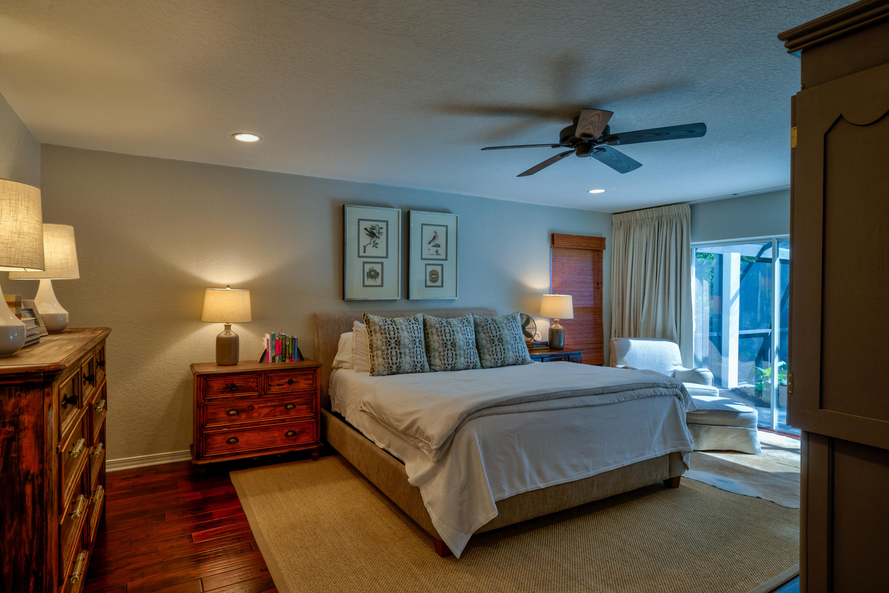 4639 Paradise Isle Destin, FL 32541 - Photo 33 of 67 a bedroom with a bed and a lamp on dresser