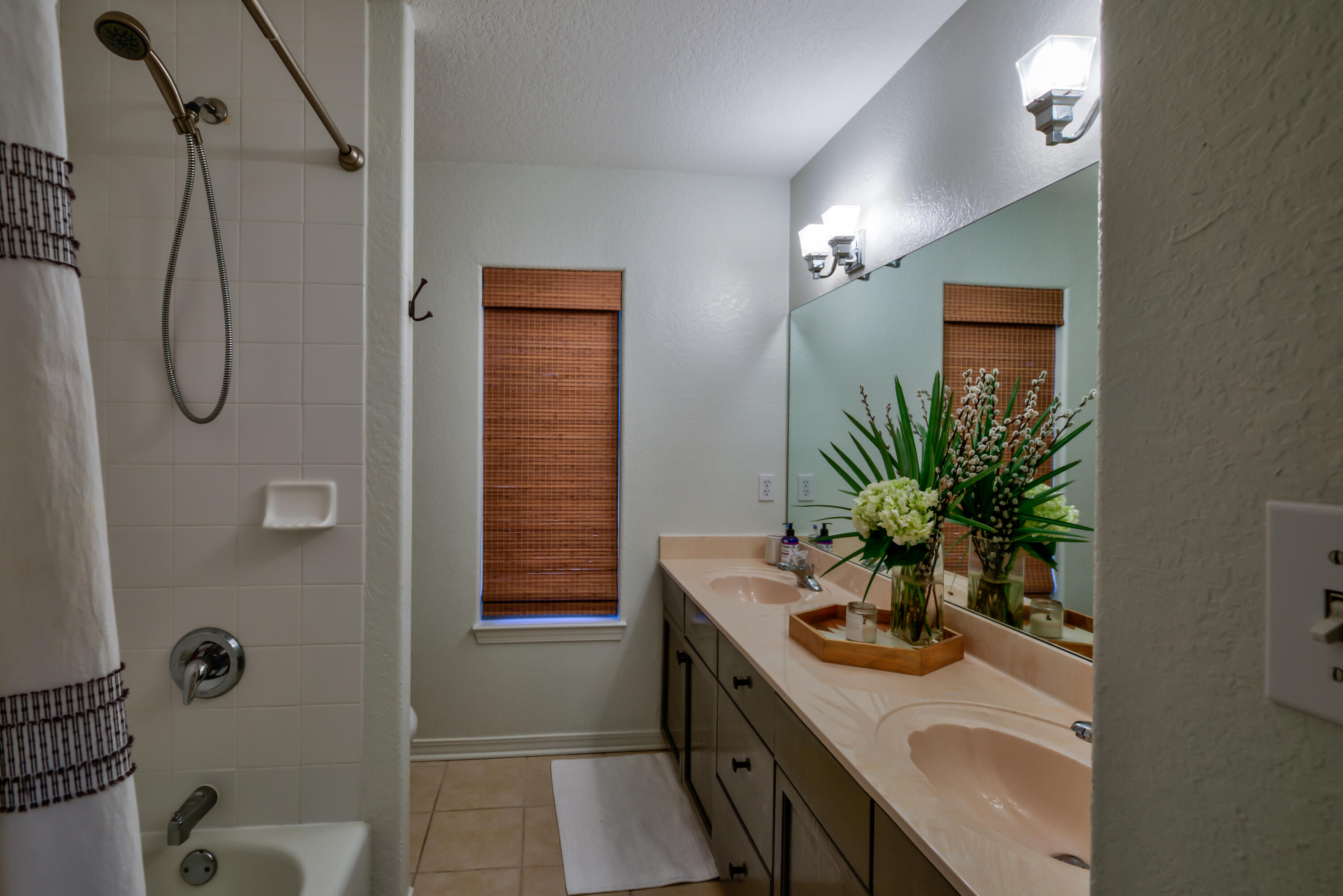 4639 Paradise Isle Destin, FL 32541 - Photo 44 of 67 a bathroom with a sink a toilet a mirror and vanity