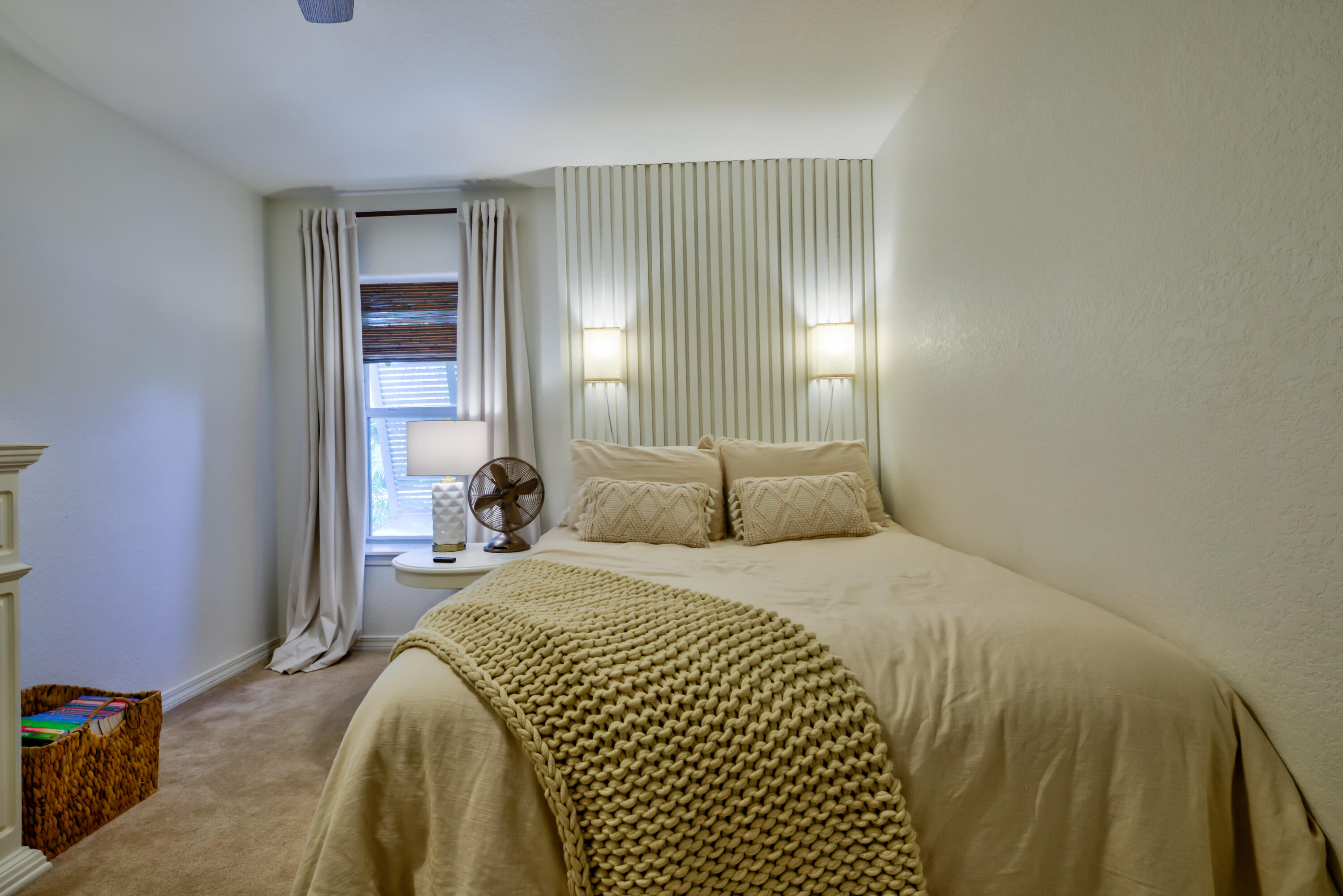 4639 Paradise Isle Destin, FL 32541 - Photo 49 of 67 a bedroom with a bed and a mirror