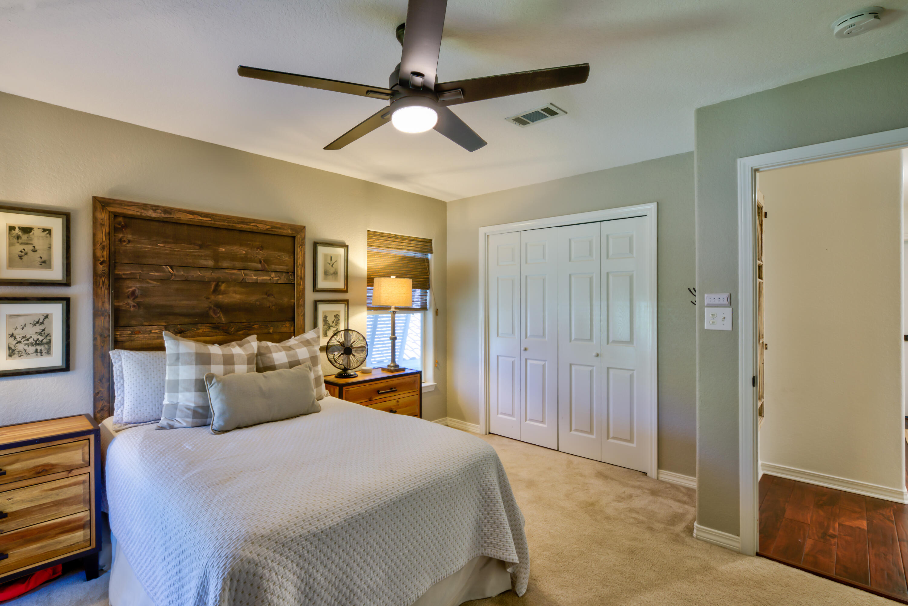 4639 Paradise Isle Destin, FL 32541 - Photo 52 of 67 a bedroom with a large bed a chandelier and closet