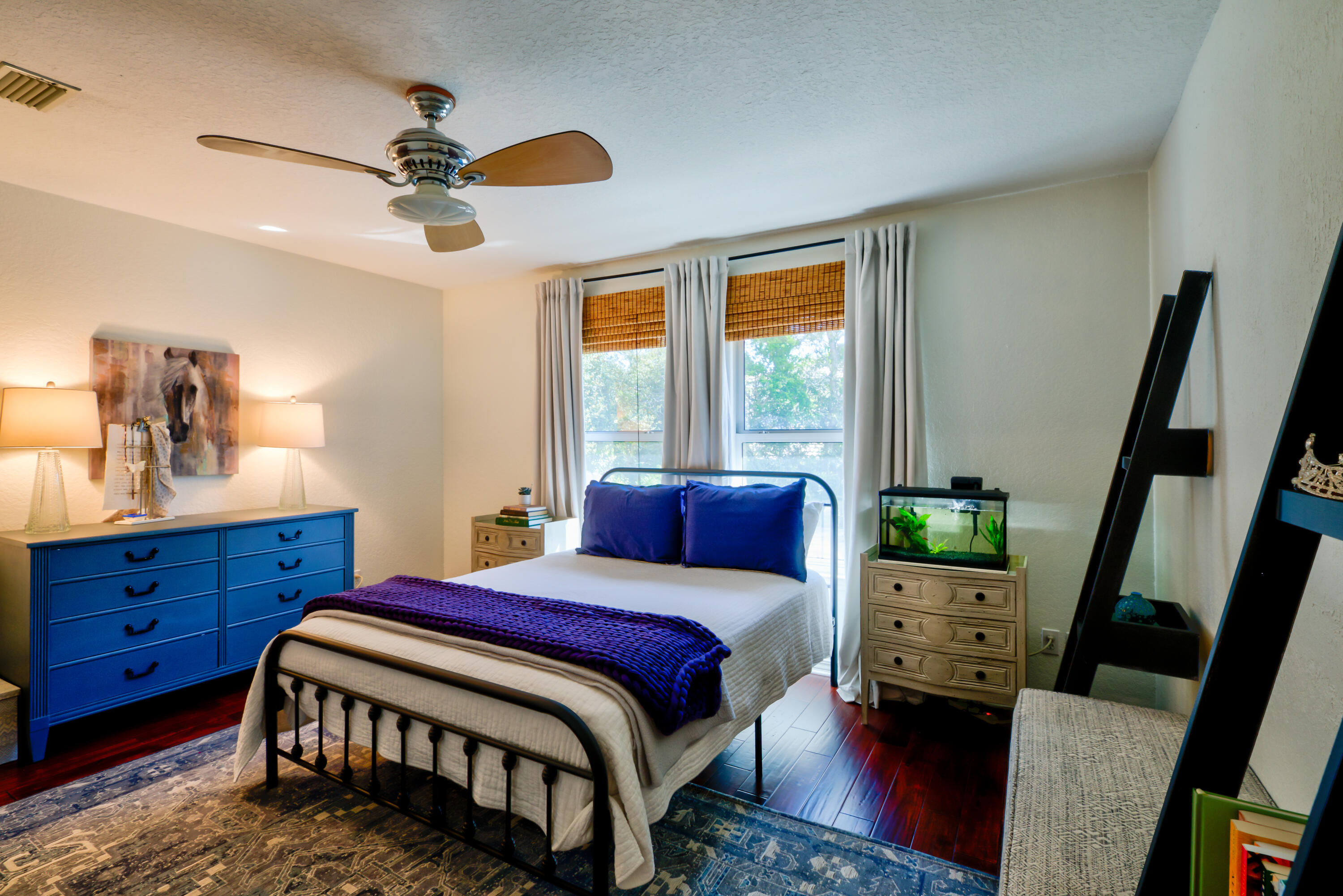 4639 Paradise Isle Destin, FL 32541 - Photo 53 of 67 a bedroom with a bed a chandelier and a dresser