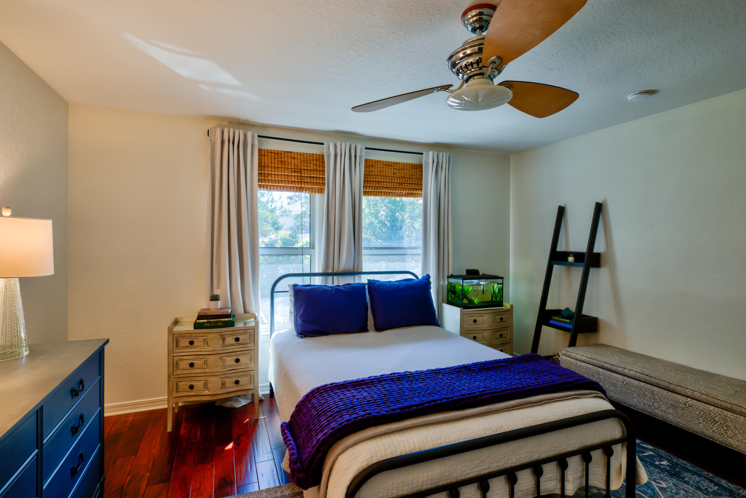 4639 Paradise Isle Destin, FL 32541 - Photo 54 of 67 a bedroom with a bed and wooden floor