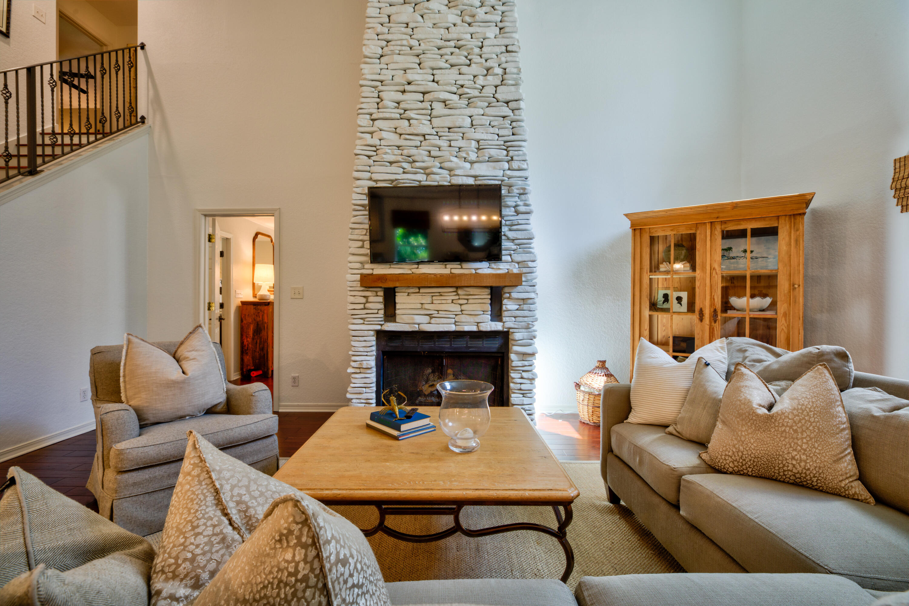 4639 Paradise Isle Destin, FL 32541 - Photo 57 of 67 a living room with furniture a flat screen tv and a fireplace