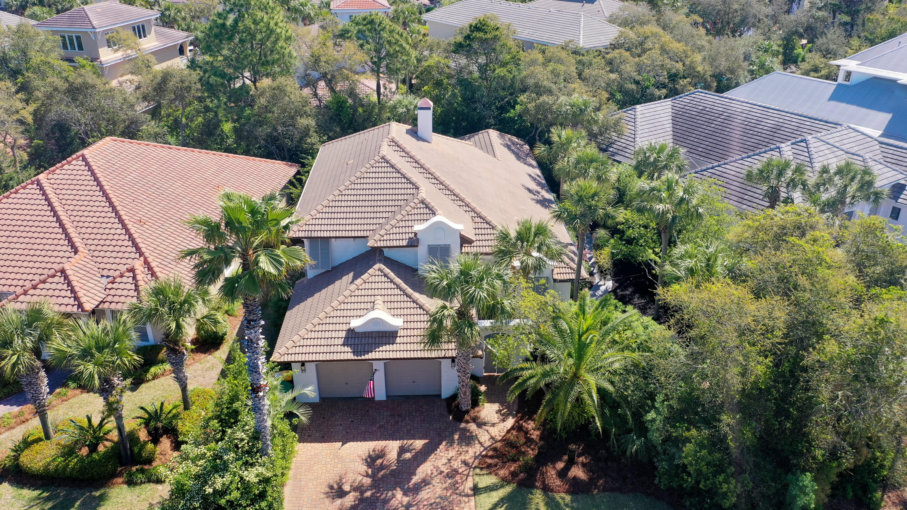4639 Paradise Isle Destin, FL 32541 - Photo 60 of 67 a view of a house with a yard and garden