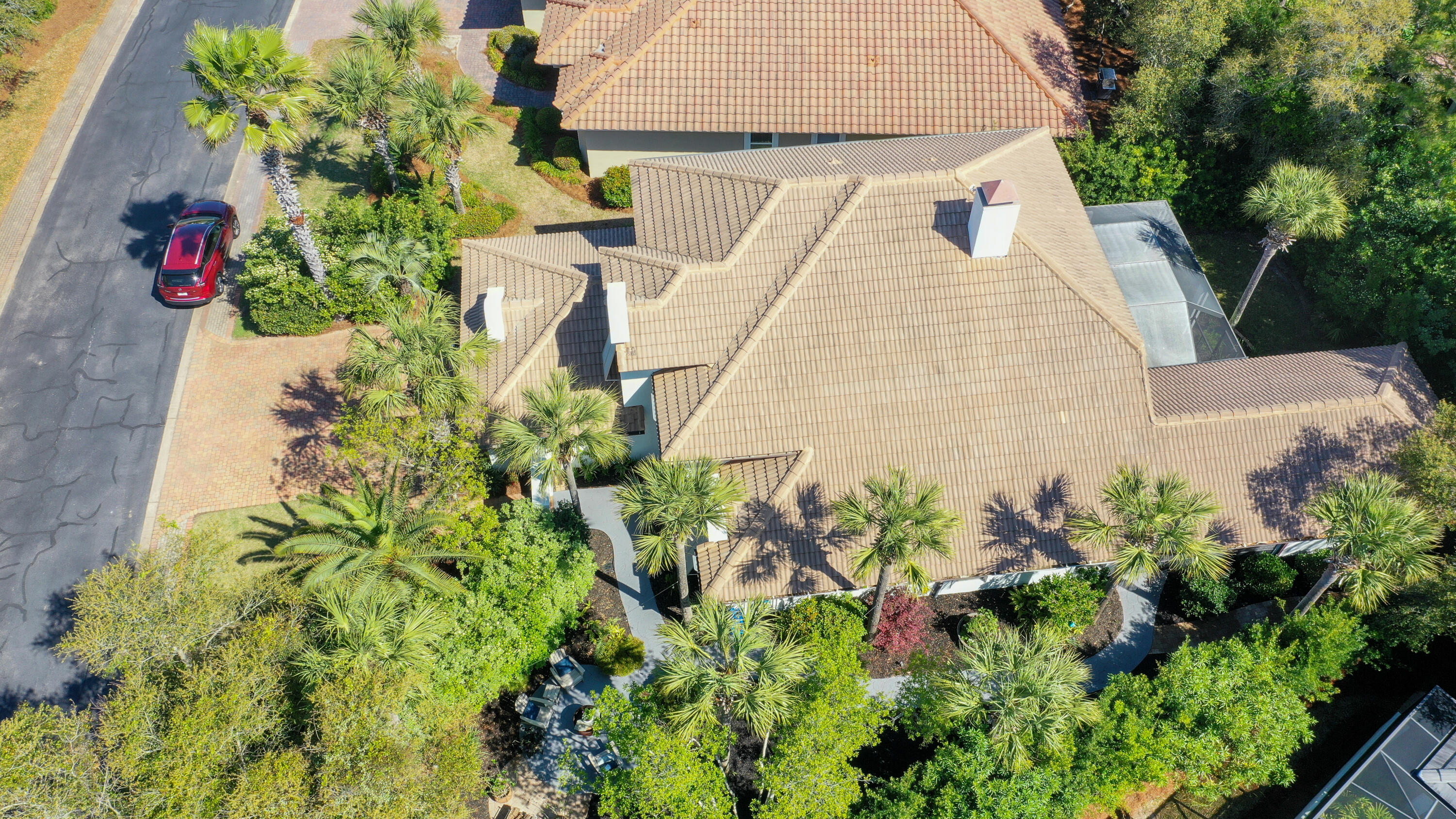 4639 Paradise Isle Destin, FL 32541 - Photo 61 of 67 a aerial view of a house with a yard and garden