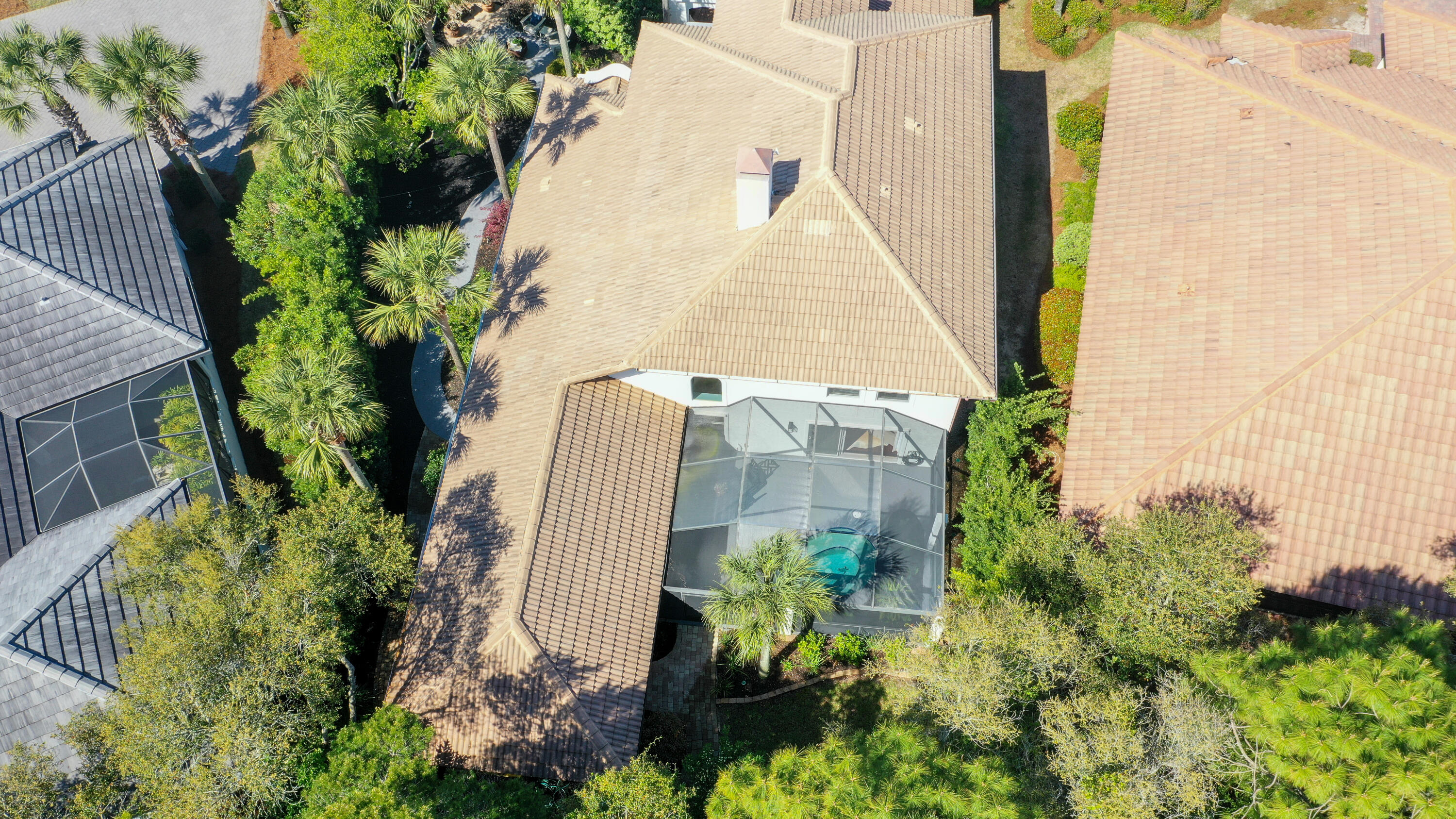4639 Paradise Isle Destin, FL 32541 - Photo 62 of 67 an aerial view of a multi story residential apartment building with a yard and plants