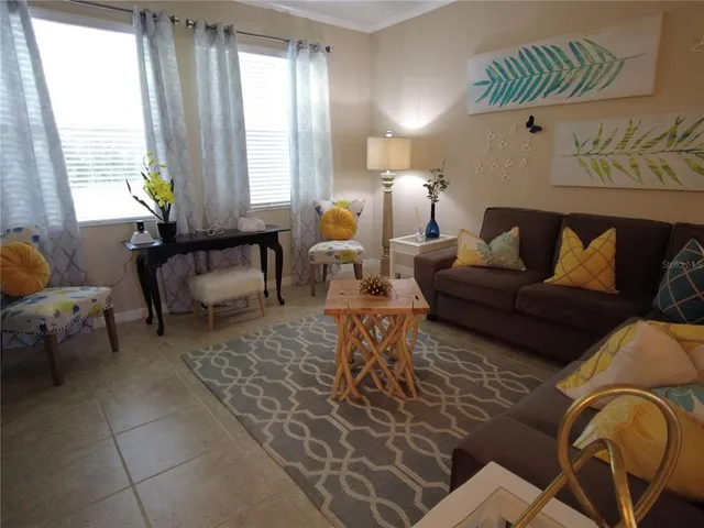 a living room with furniture and a window