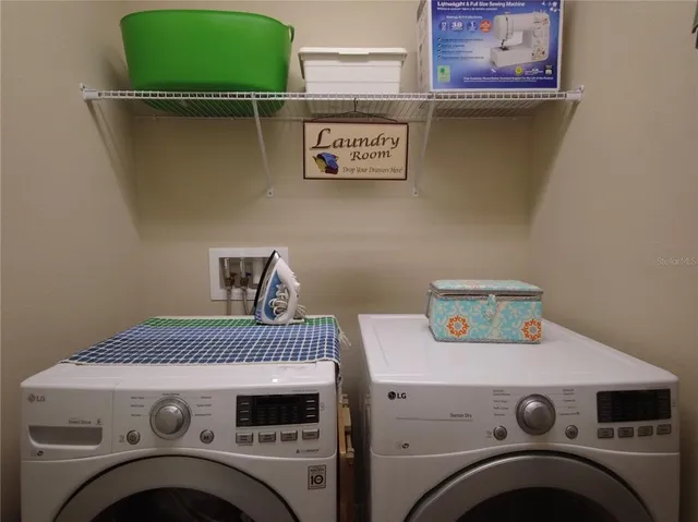 a utility room with dryer and washer