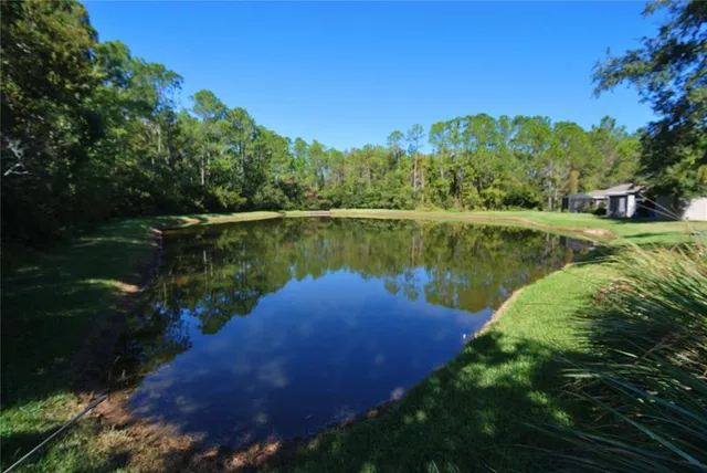 a view of a lake with a yard